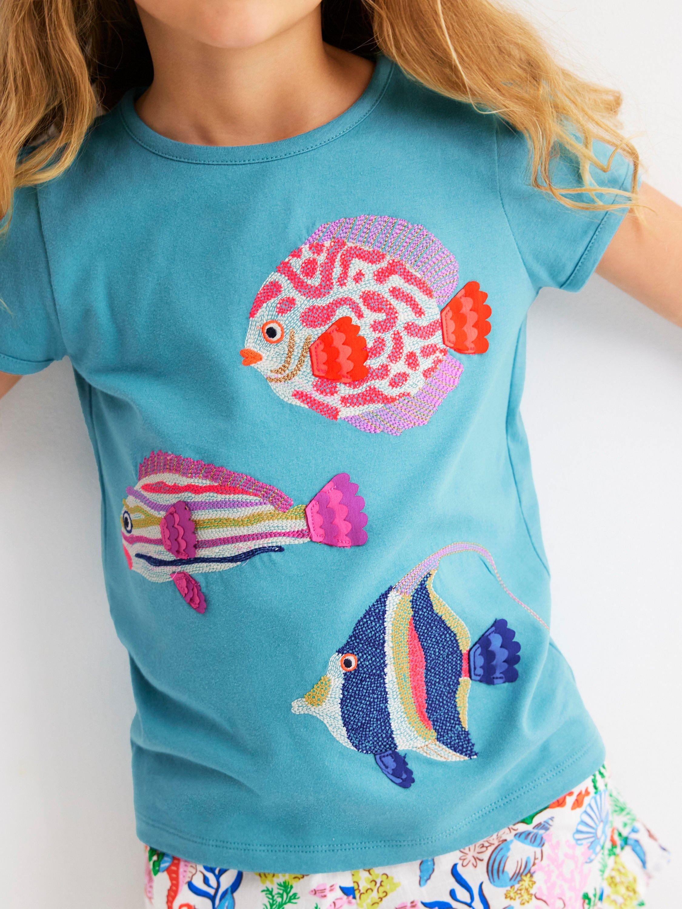 Product image 2 of 5, which shows Mini Boden Kids' Cotton Short Sleeved Applique T-Shirt, Aqua Sea Blue Fish, 9-10 years