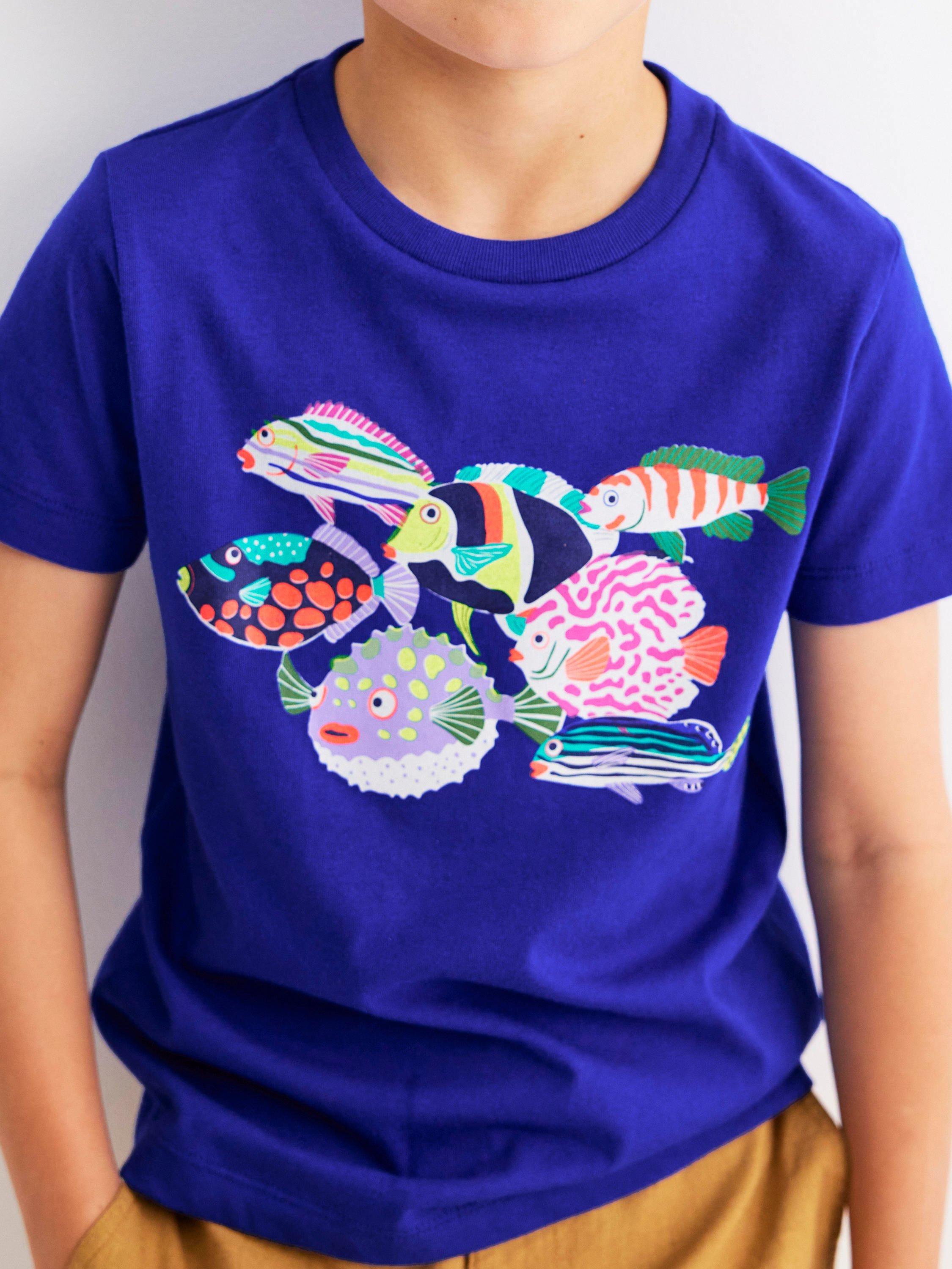 Product image 2 of 5, which shows Mini Boden Kids' Cotton Riso Relaxed Printed T-Shirt, Blue Heron Fish, 7-8 years