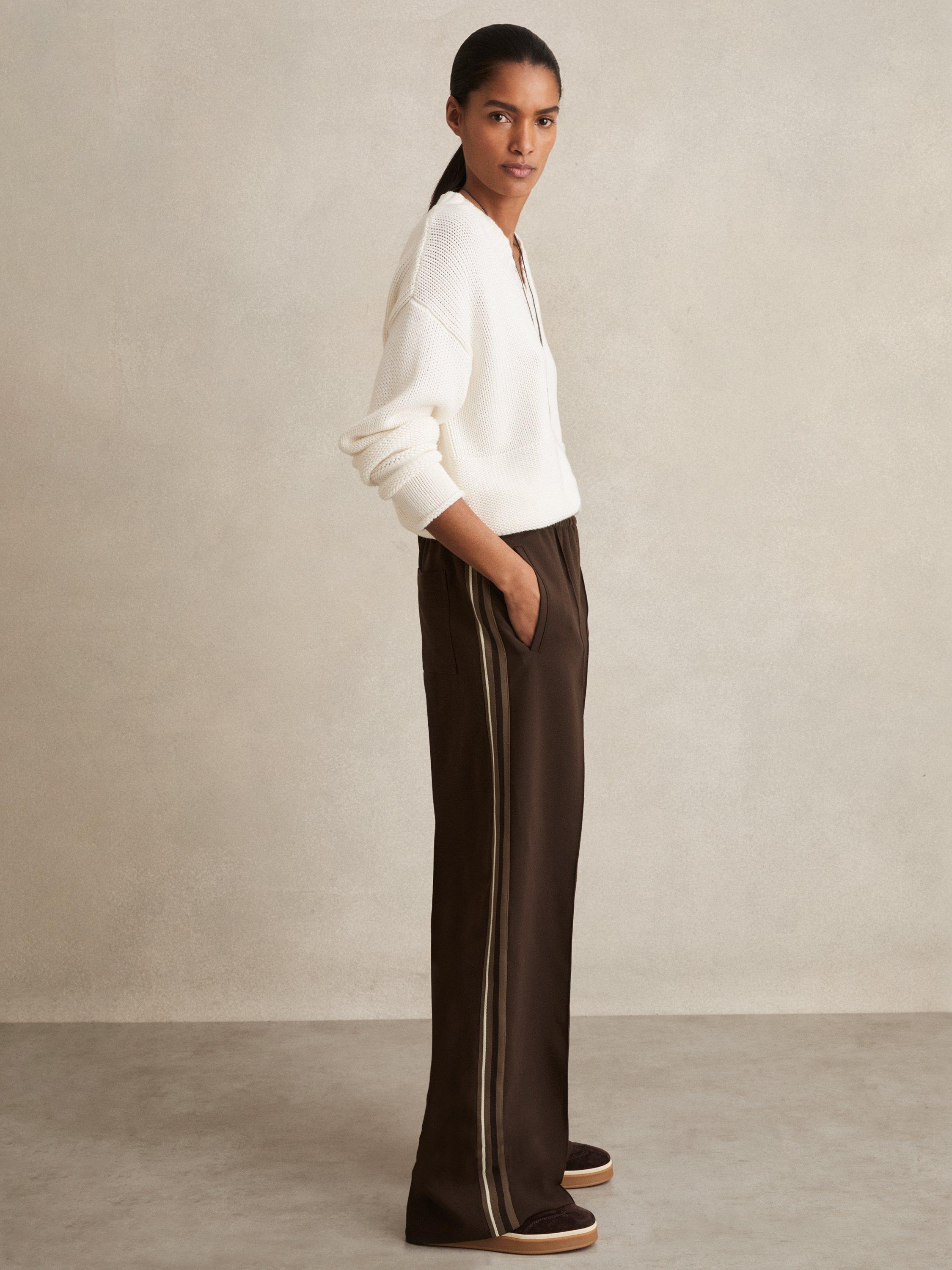 Product image 1 of 5, which shows Reiss Robyn Petite Side Stripe Mid Rise Mixed Blend Wide Leg Trousers, Chocolate Brown, 6Pt