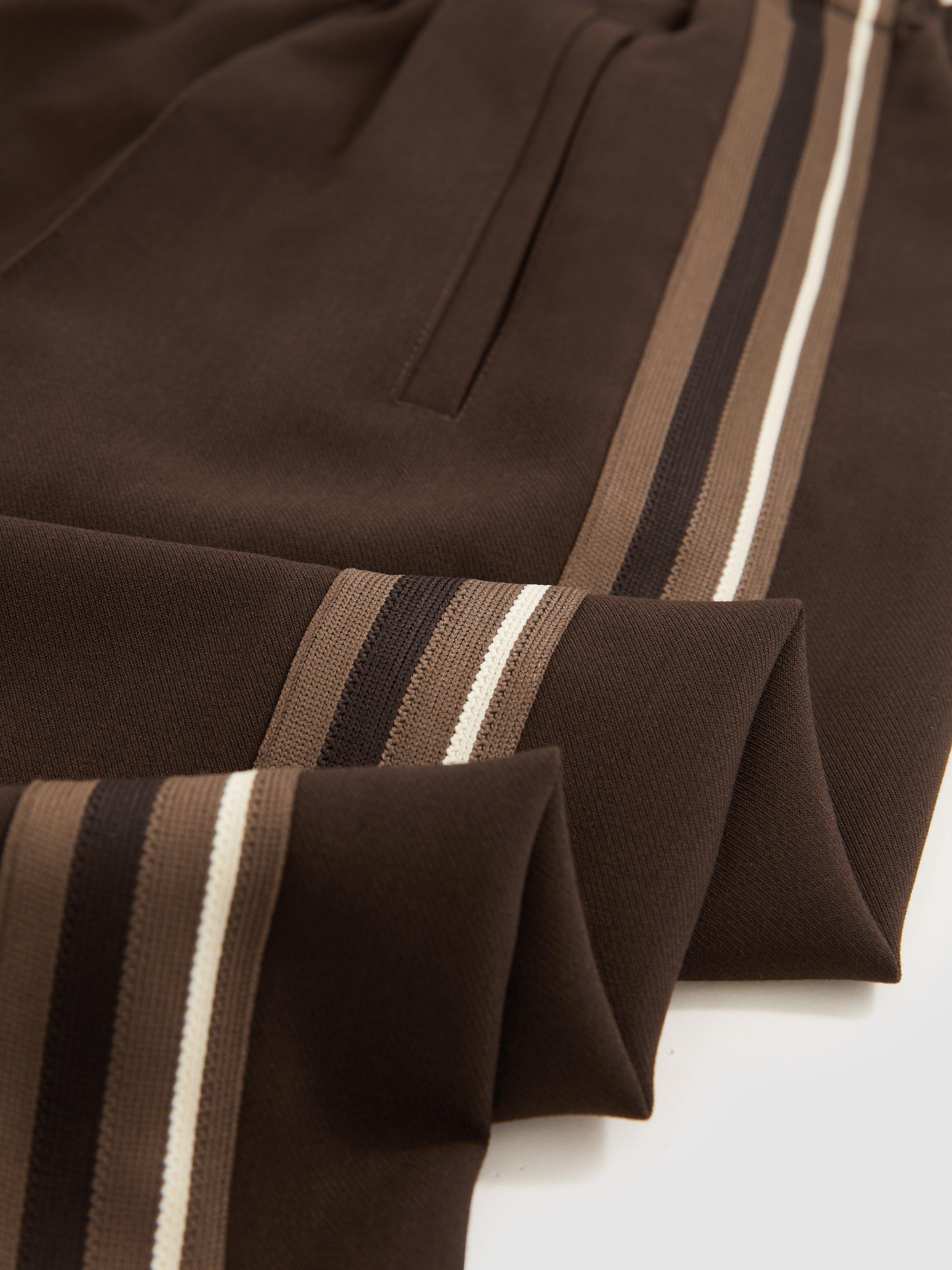 Product image 2 of 5, which shows Reiss Robyn Petite Side Stripe Mid Rise Mixed Blend Wide Leg Trousers, Chocolate Brown, 6Pt