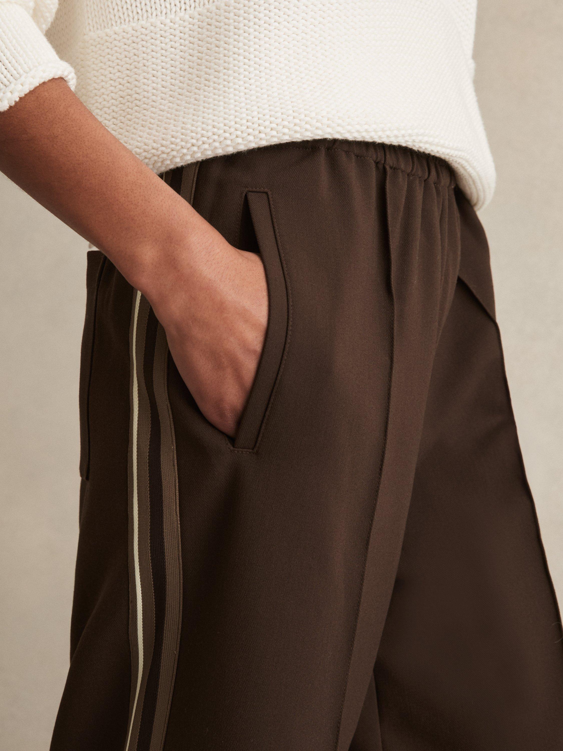 Product image 4 of 5, which shows Reiss Robyn Petite Side Stripe Mid Rise Mixed Blend Wide Leg Trousers, Chocolate Brown, 6Pt