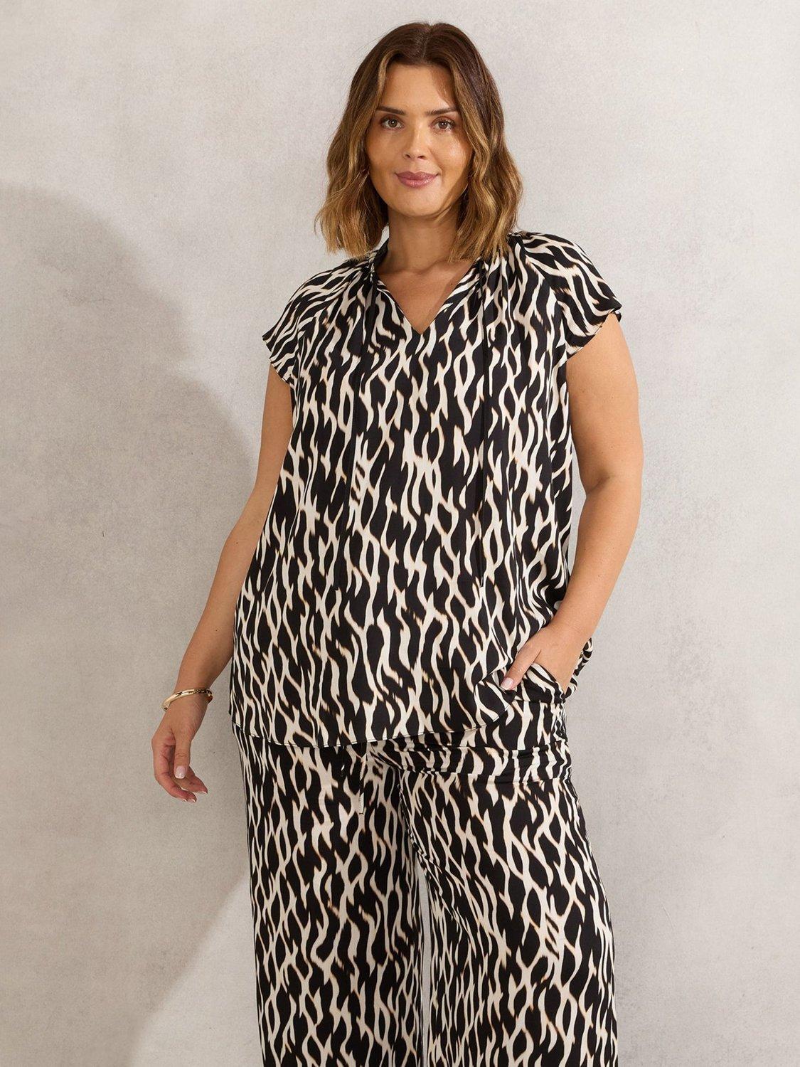 Product image 1 of 3, which shows Live Unlimited Curve Abstract Tie Neck Top, Black, 12
