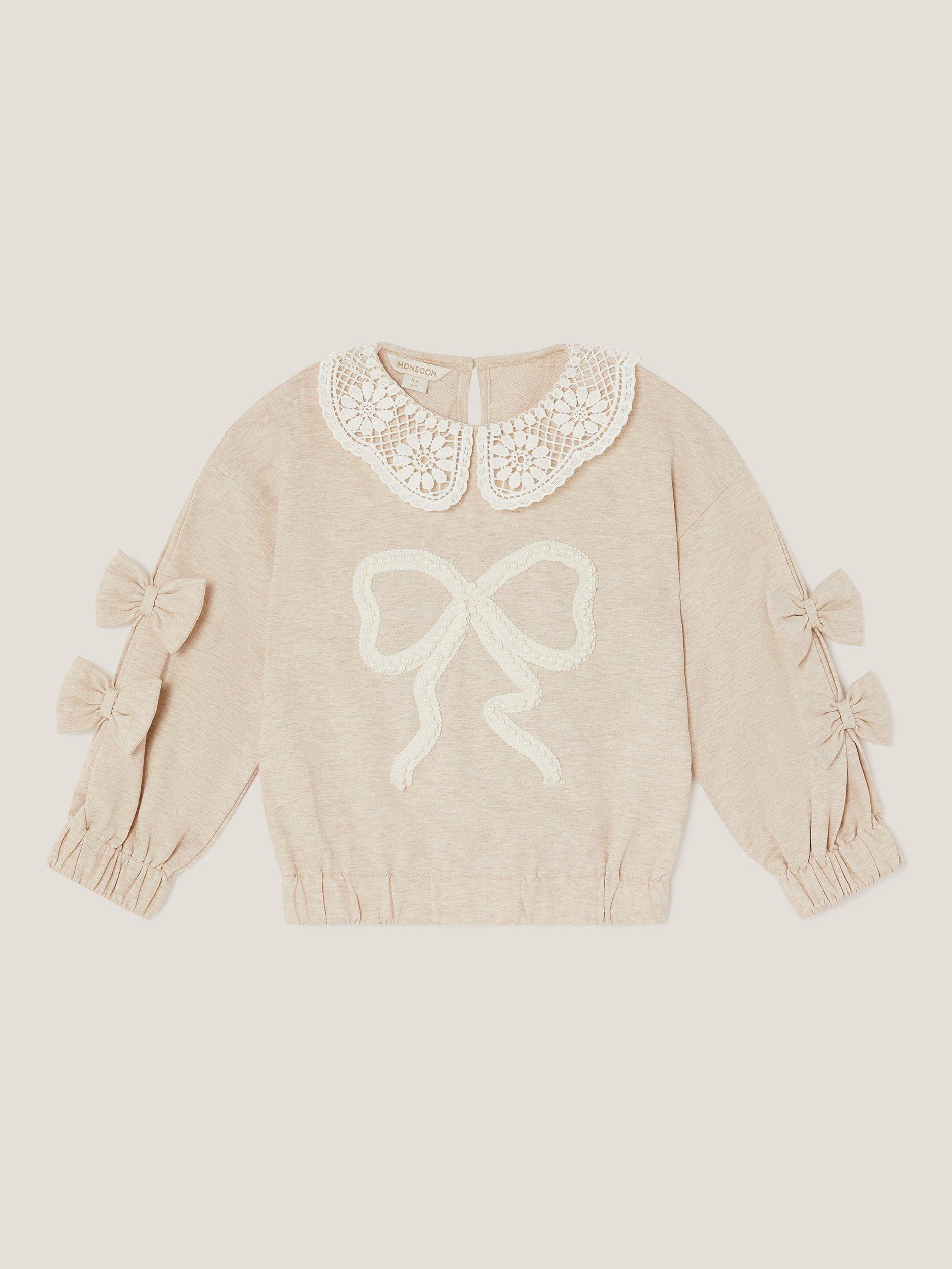 Product image 1 of 3, which shows Monsoon Kids' Cotton Lace Collar Bow Sweatshirt, Ivory, 3-4 years