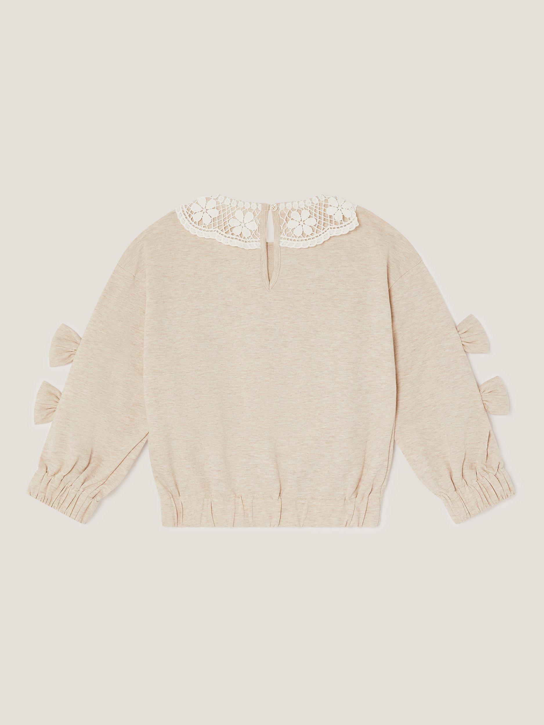 Product image 2 of 3, which shows Monsoon Kids' Cotton Lace Collar Bow Sweatshirt, Ivory, 3-4 years
