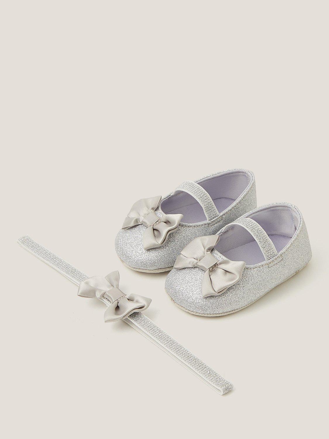 Product image 1 of 3, which shows Monsoon Baby Glitter Bow Bootie and Headband Set, Silver, 0-3 months