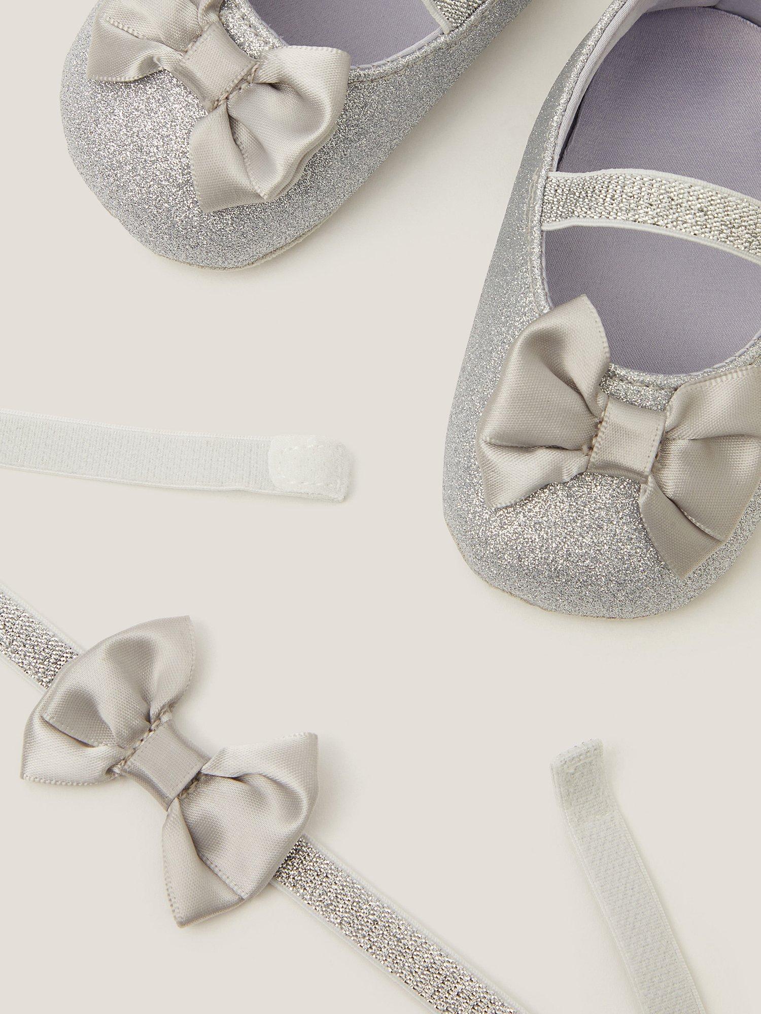 Product image 3 of 3, which shows Monsoon Baby Glitter Bow Bootie and Headband Set, Silver, 0-3 months