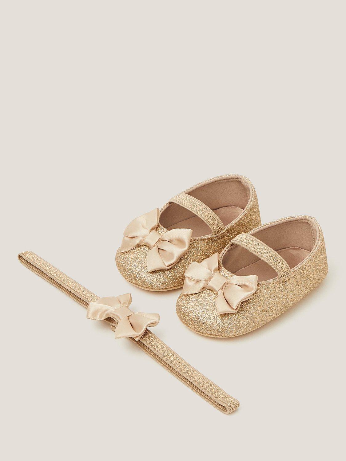 Product image 1 of 3, which shows Monsoon Baby Glitter Bow Bootie and Headband Set, Gold, 6-12 months