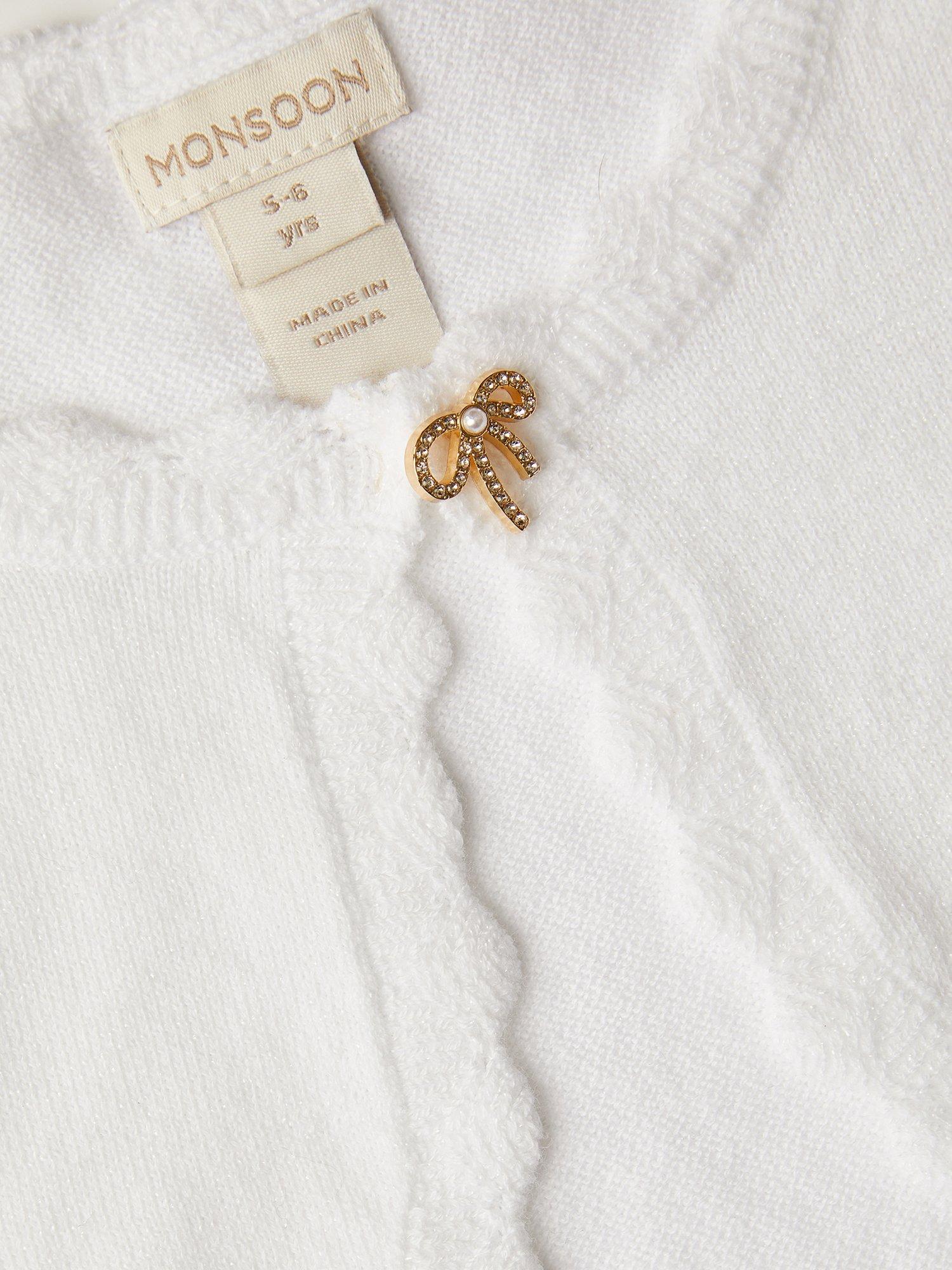 Product image 3 of 3, which shows Monsoon Kids' Knitted Bow Button Cardigan, Ivory, 3-4 years
