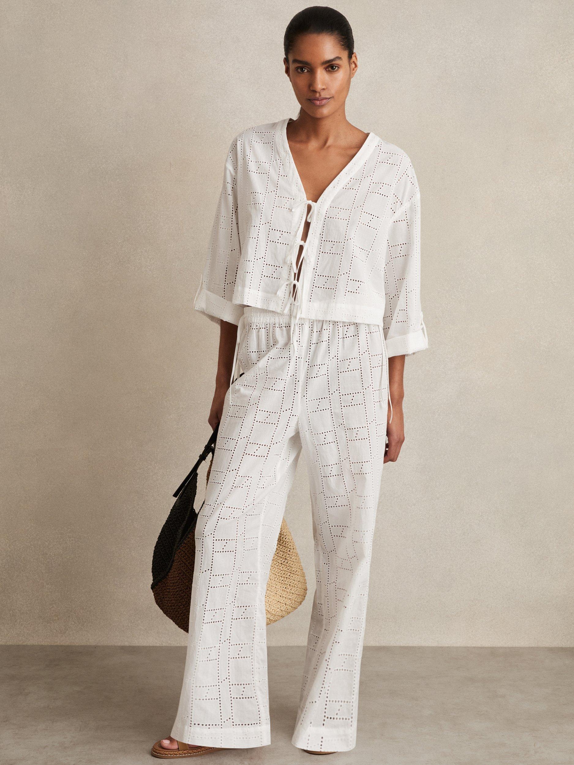 Product image 1 of 5, which shows Reiss Nadia Broderie Anglaise Tie Front Top, White, XS