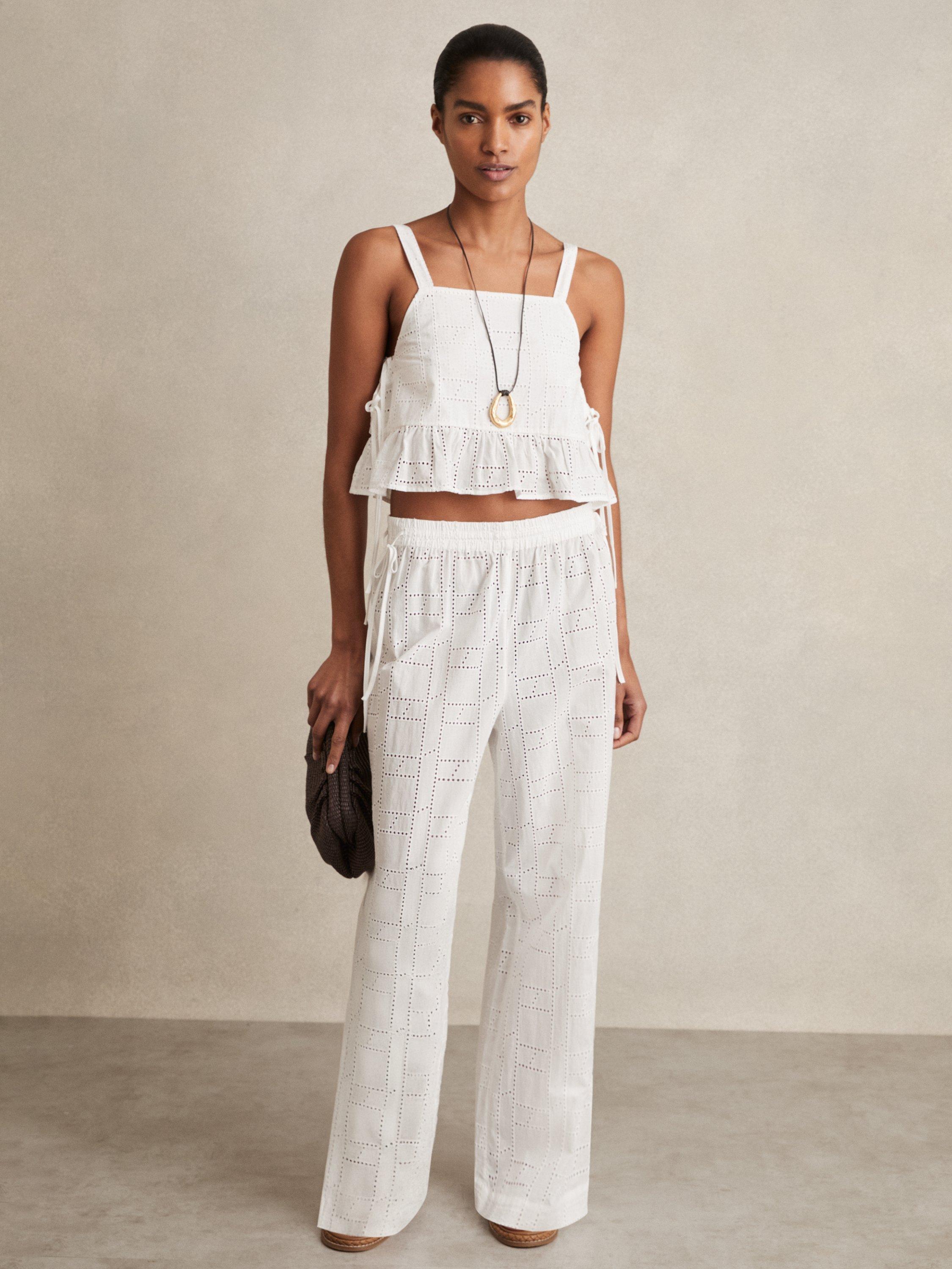 Product image 1 of 5, which shows Reiss Poppy Broderie Anglaise Side Tie Top, White, XS