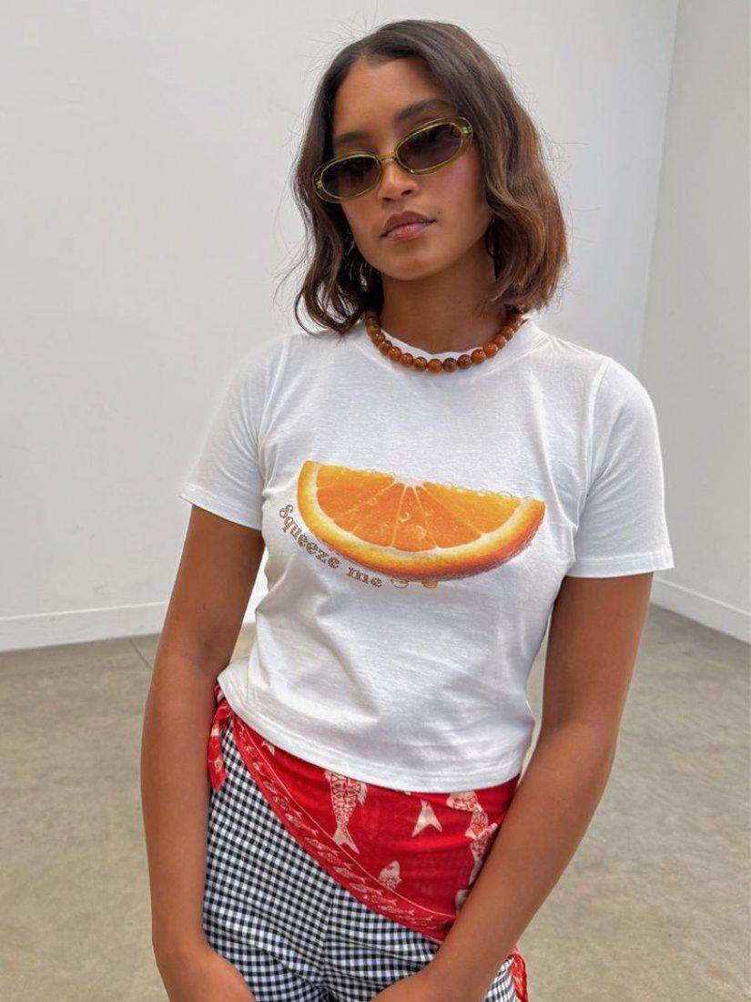 Product image 1 of 5, which shows Never Fully Dressed Squeeze Me Orange T-Shirt, White, XS