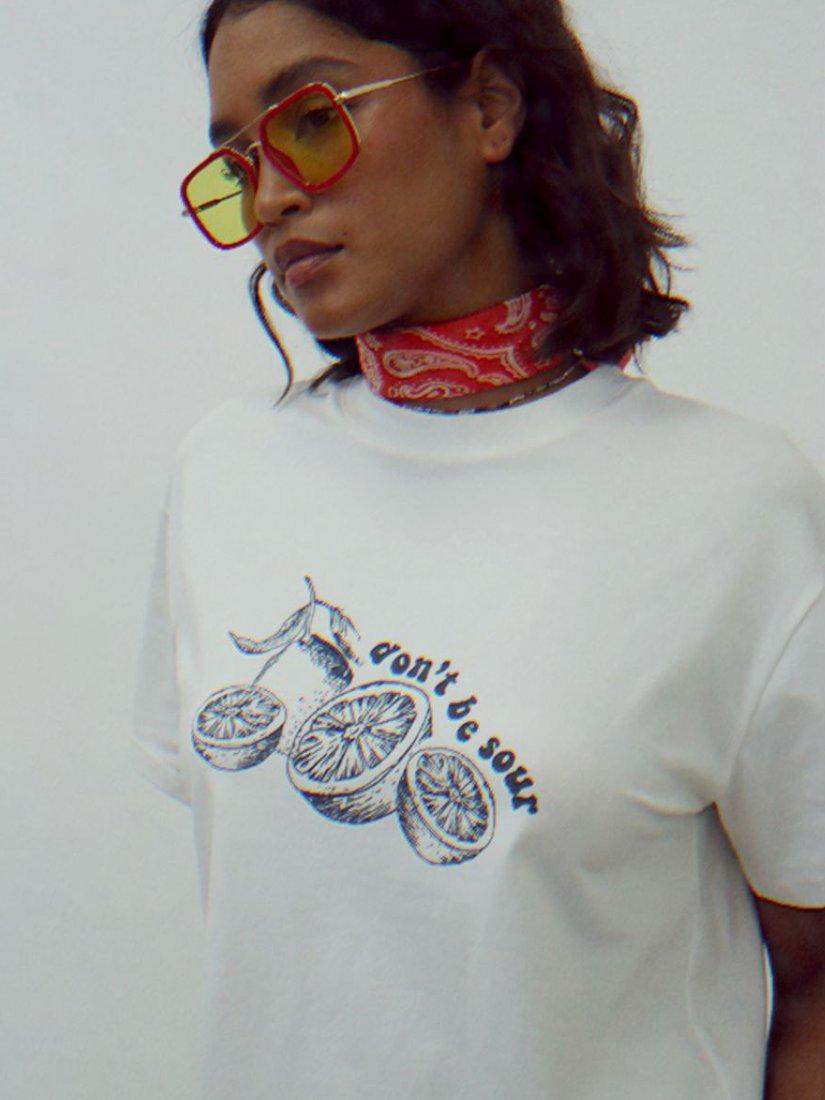 Product image 2 of 5, which shows Never Fully Dressed Don't Be Sour T-Shirt, White, XS