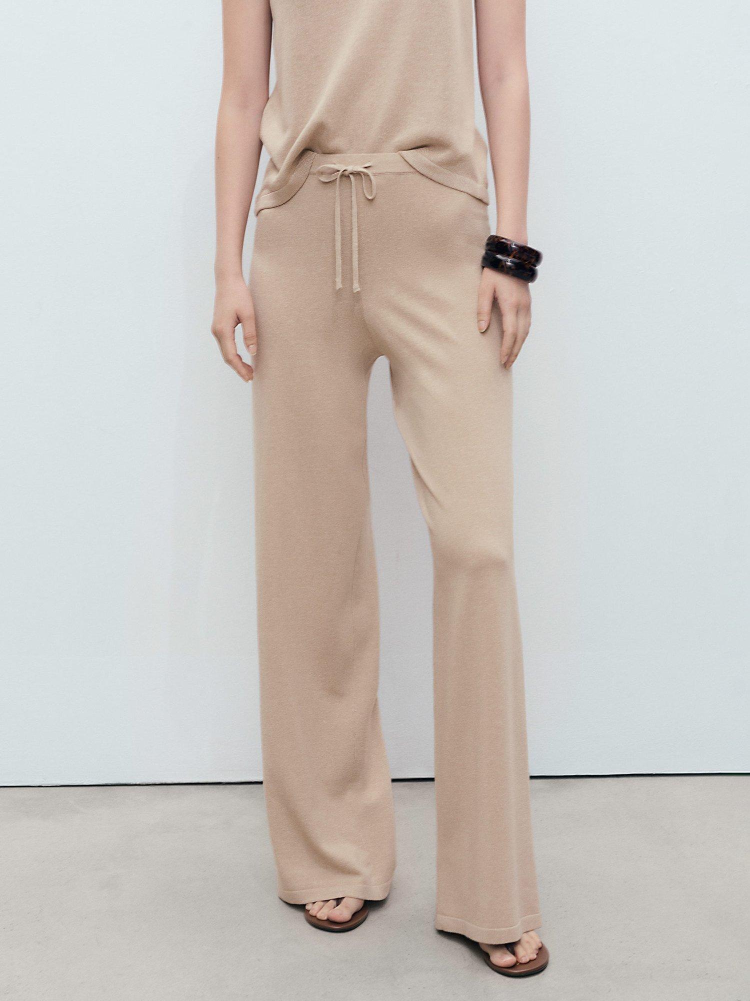 Product image 1 of 8, which shows Mango Vella Straight Fine Knit Trousers, Pastel Grey, L