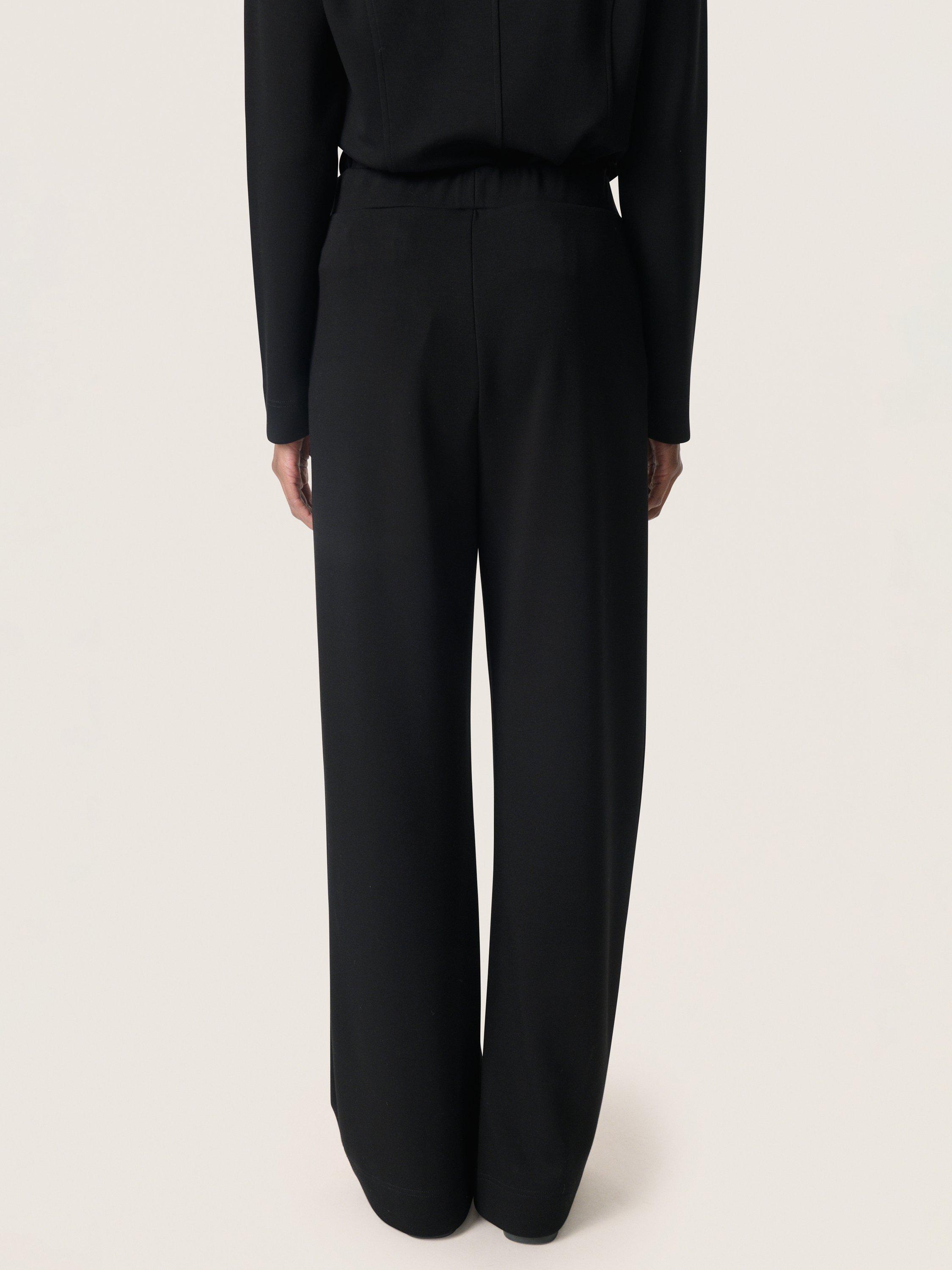 Product image 2 of 6, which shows Soaked In Luxury Marigold Flared Knitted Trousers, Black, XS