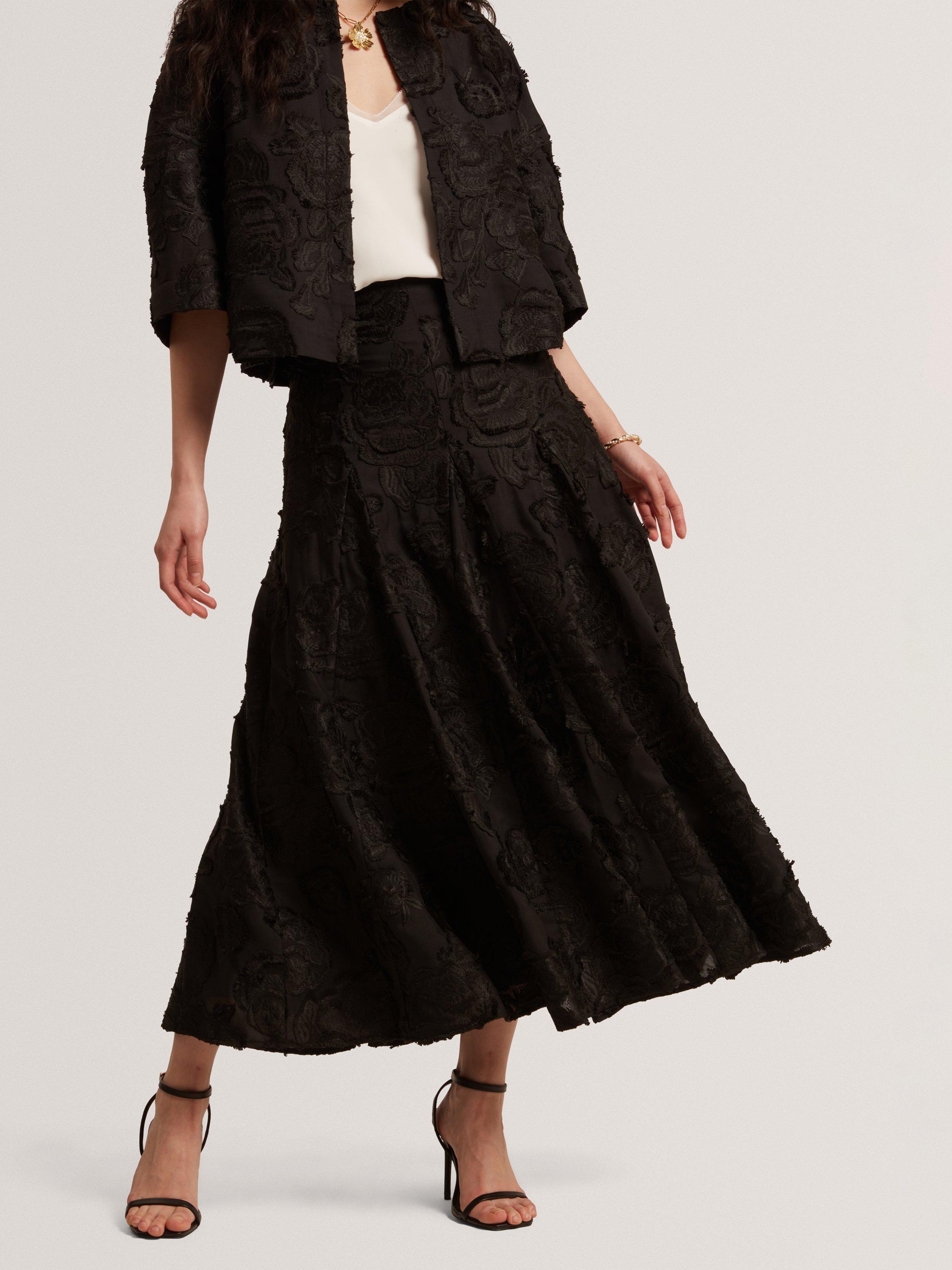 Product image 2 of 8, which shows Ted Baker Textured Rose Detail Midi Skirt, Black, 6