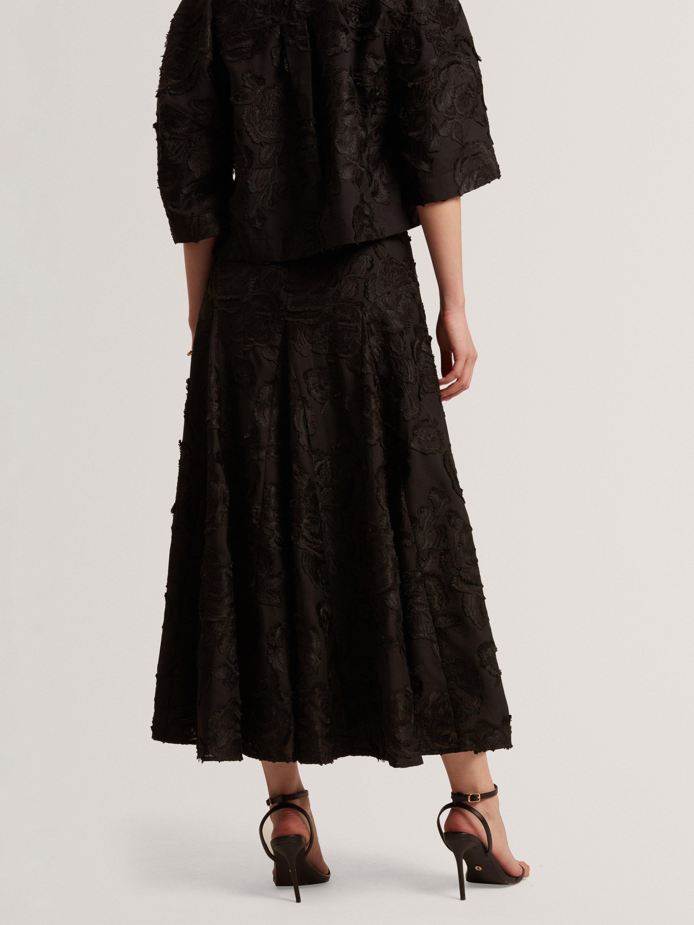 Product image 4 of 8, which shows Ted Baker Textured Rose Detail Midi Skirt, Black, 6