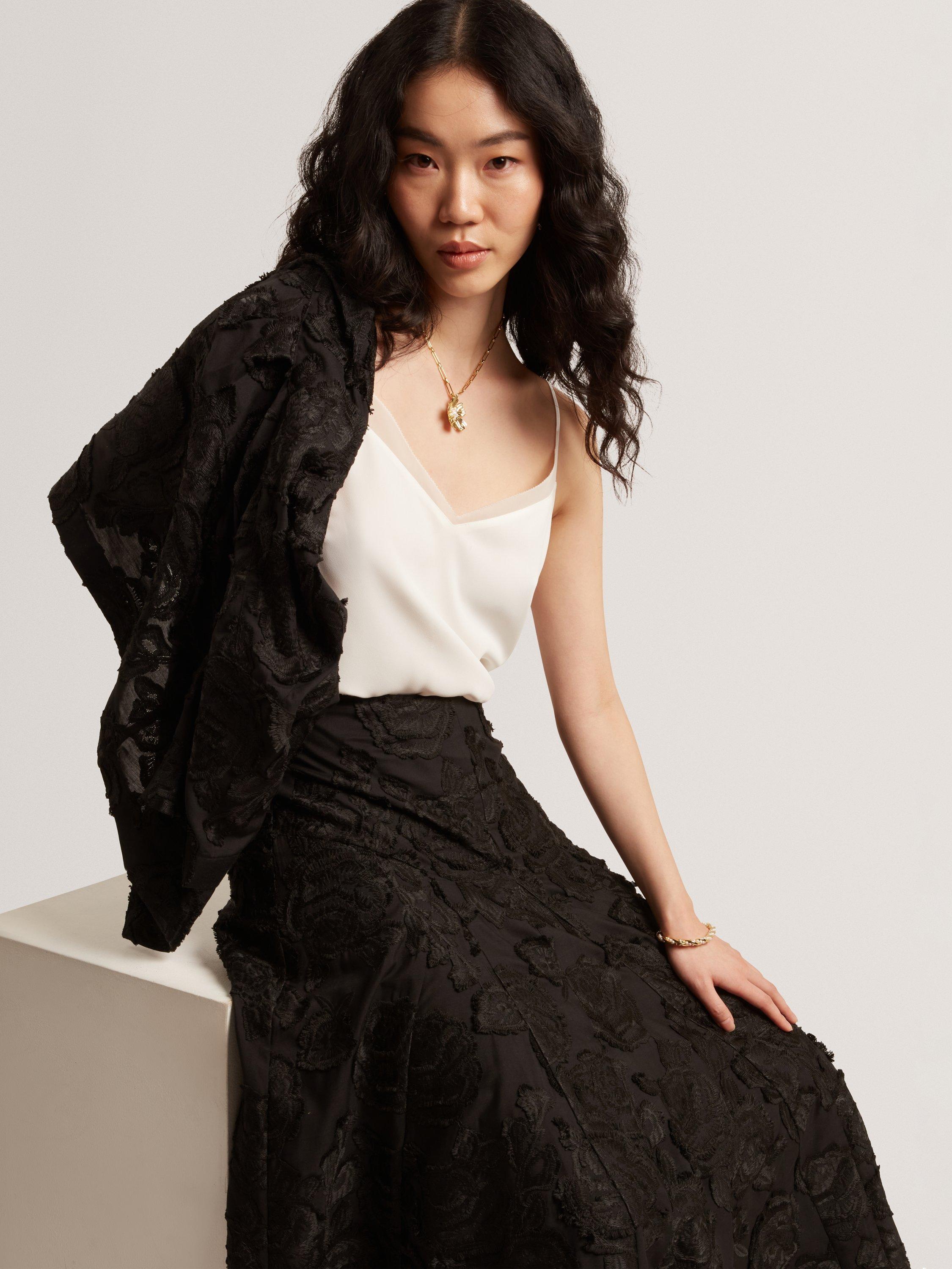 Product image 7 of 8, which shows Ted Baker Textured Rose Detail Midi Skirt, Black, 6