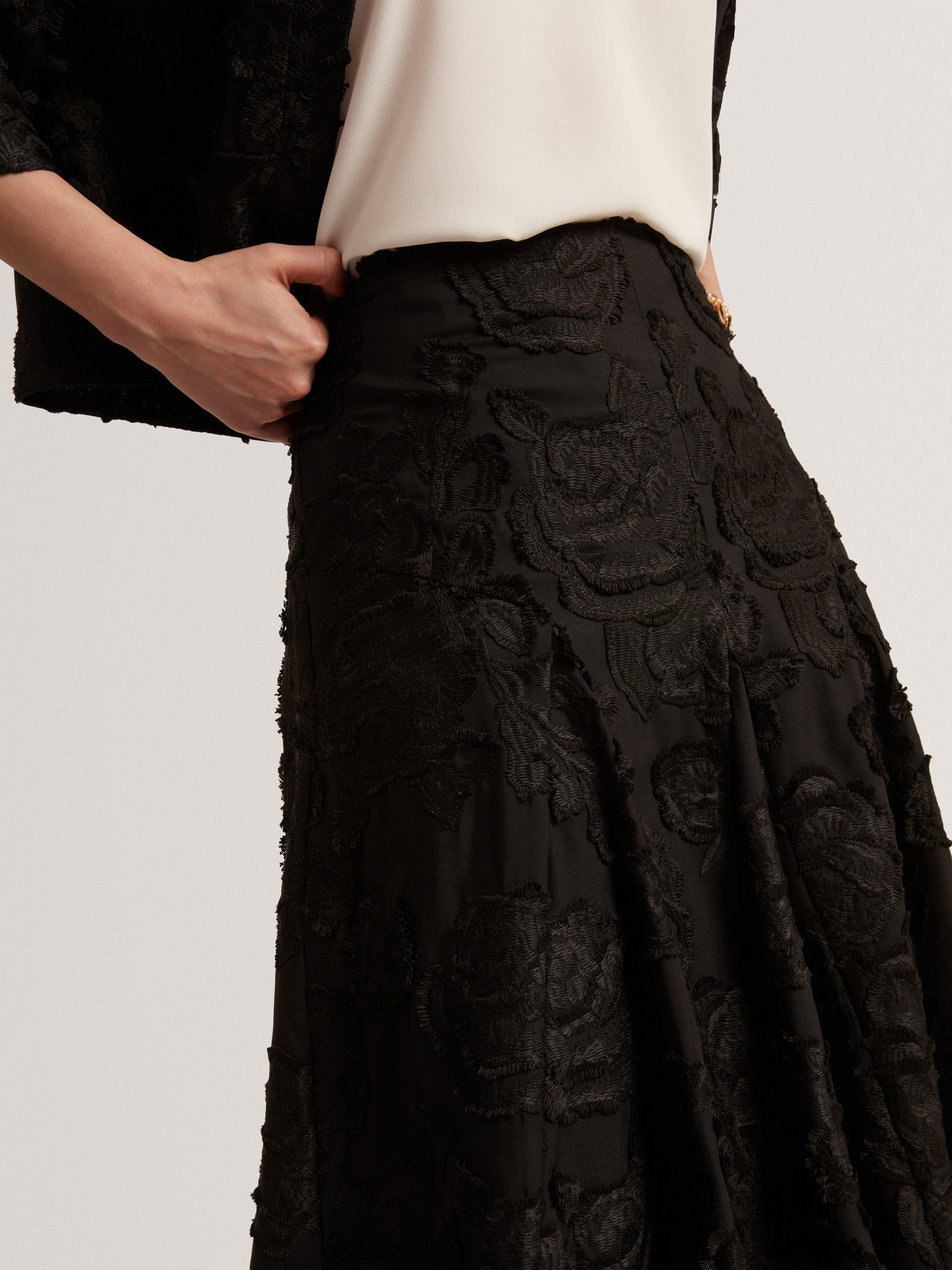 Product image 8 of 8, which shows Ted Baker Textured Rose Detail Midi Skirt, Black, 6