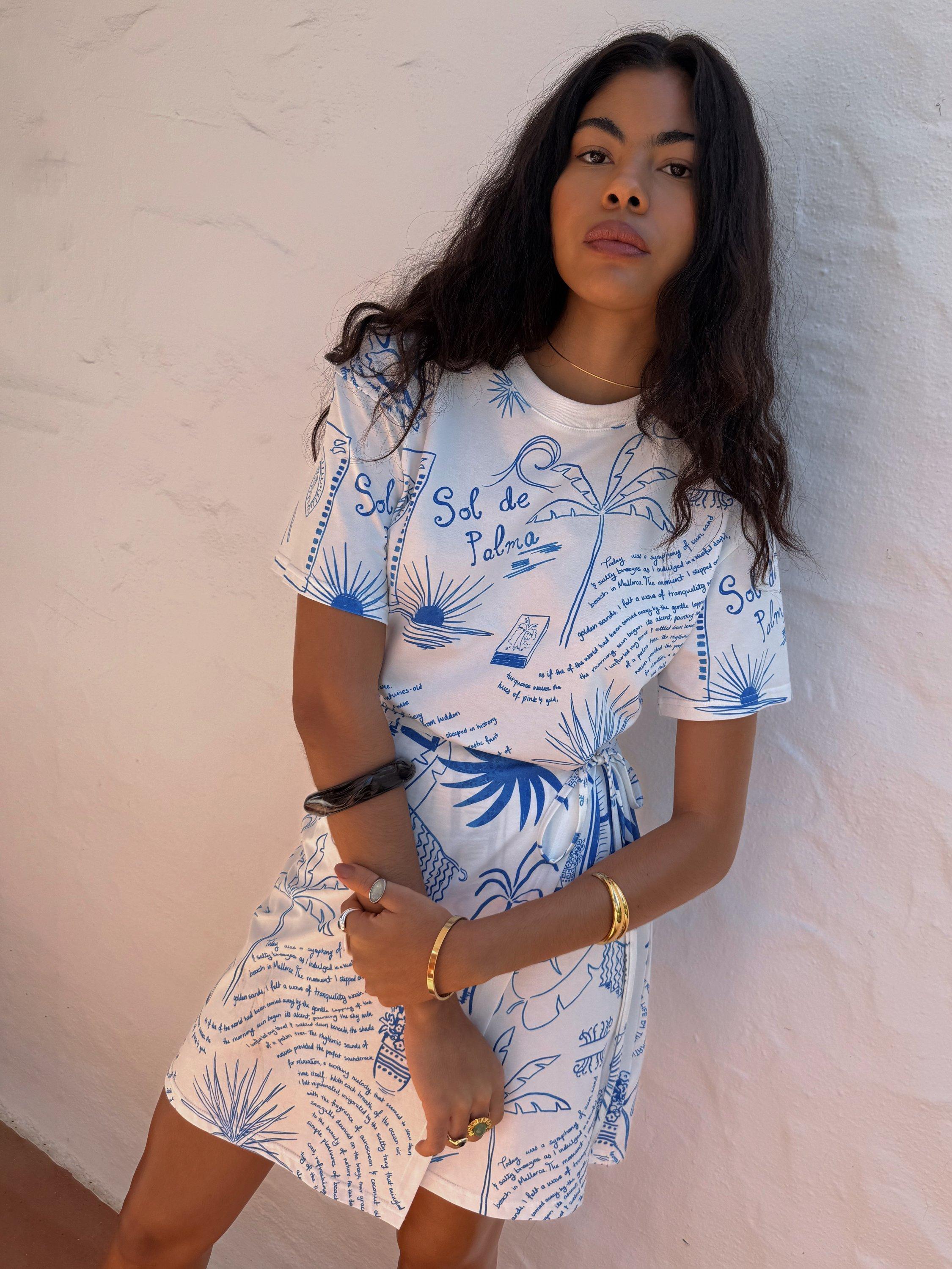 Product image 2 of 5, which shows Never Fully Dressed NFD X Caetana Palma Cotton Wrap Mini Dress, White/Blue, XS