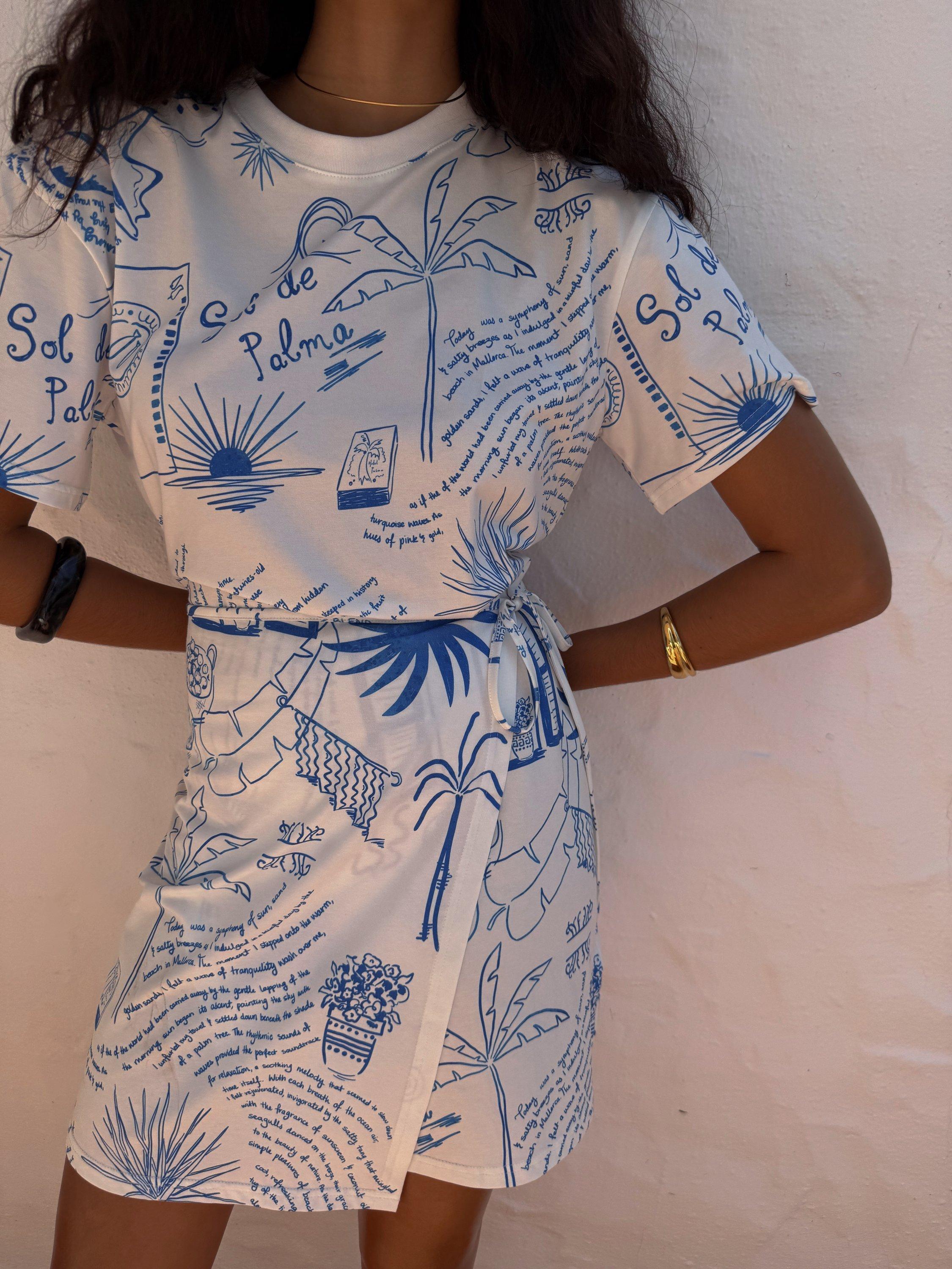 Product image 3 of 5, which shows Never Fully Dressed NFD X Caetana Palma Cotton Wrap Mini Dress, White/Blue, XS