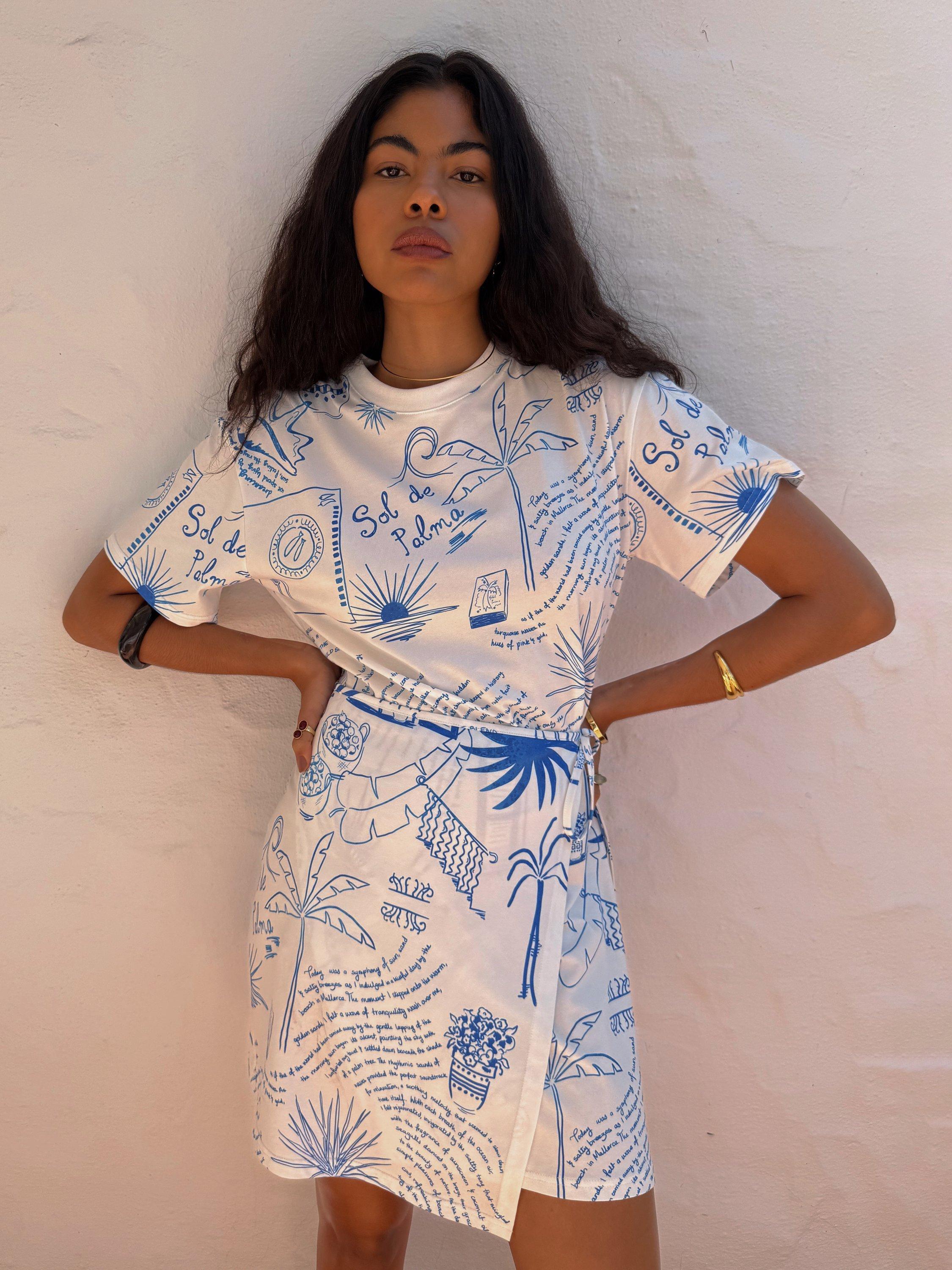 Product image 5 of 5, which shows Never Fully Dressed NFD X Caetana Palma Cotton Wrap Mini Dress, White/Blue, XS