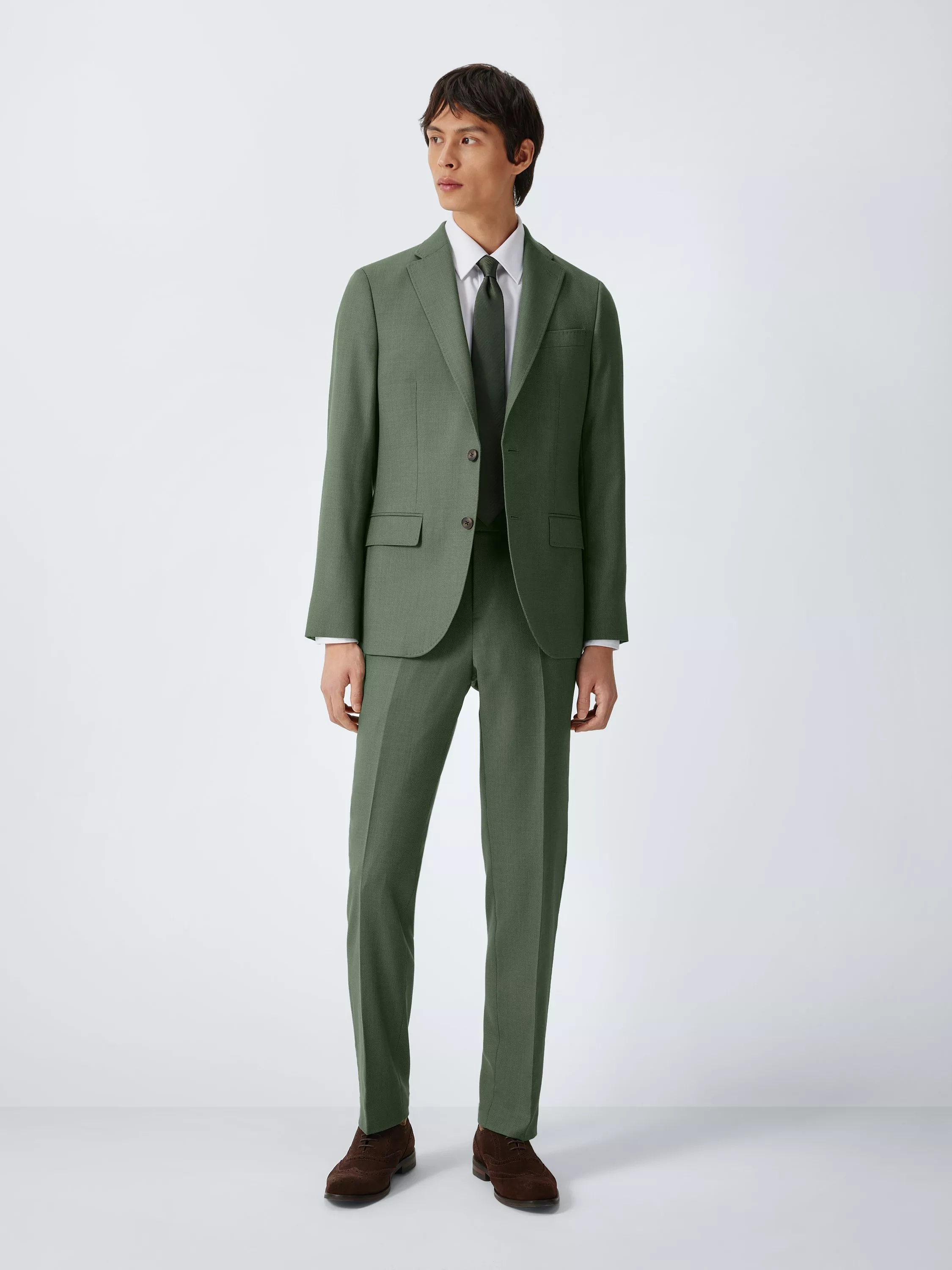 Man wearing green tailored trousers
