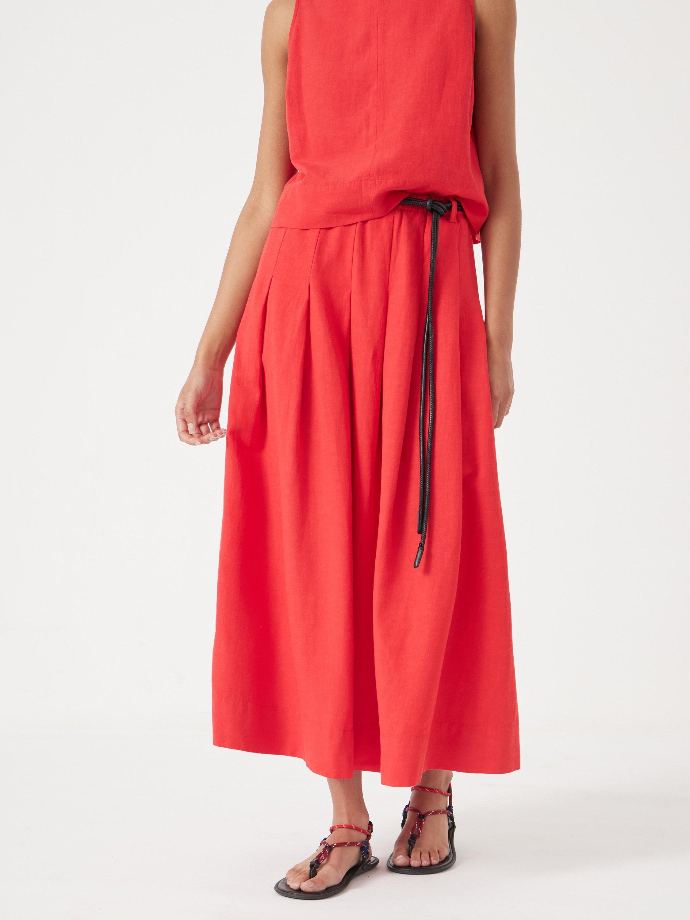 Product image 1 of 5, which shows HUSH Ivy Pleated Midi Skirt containing LENZING™ ECOVERO™ Viscose, True Red, 10