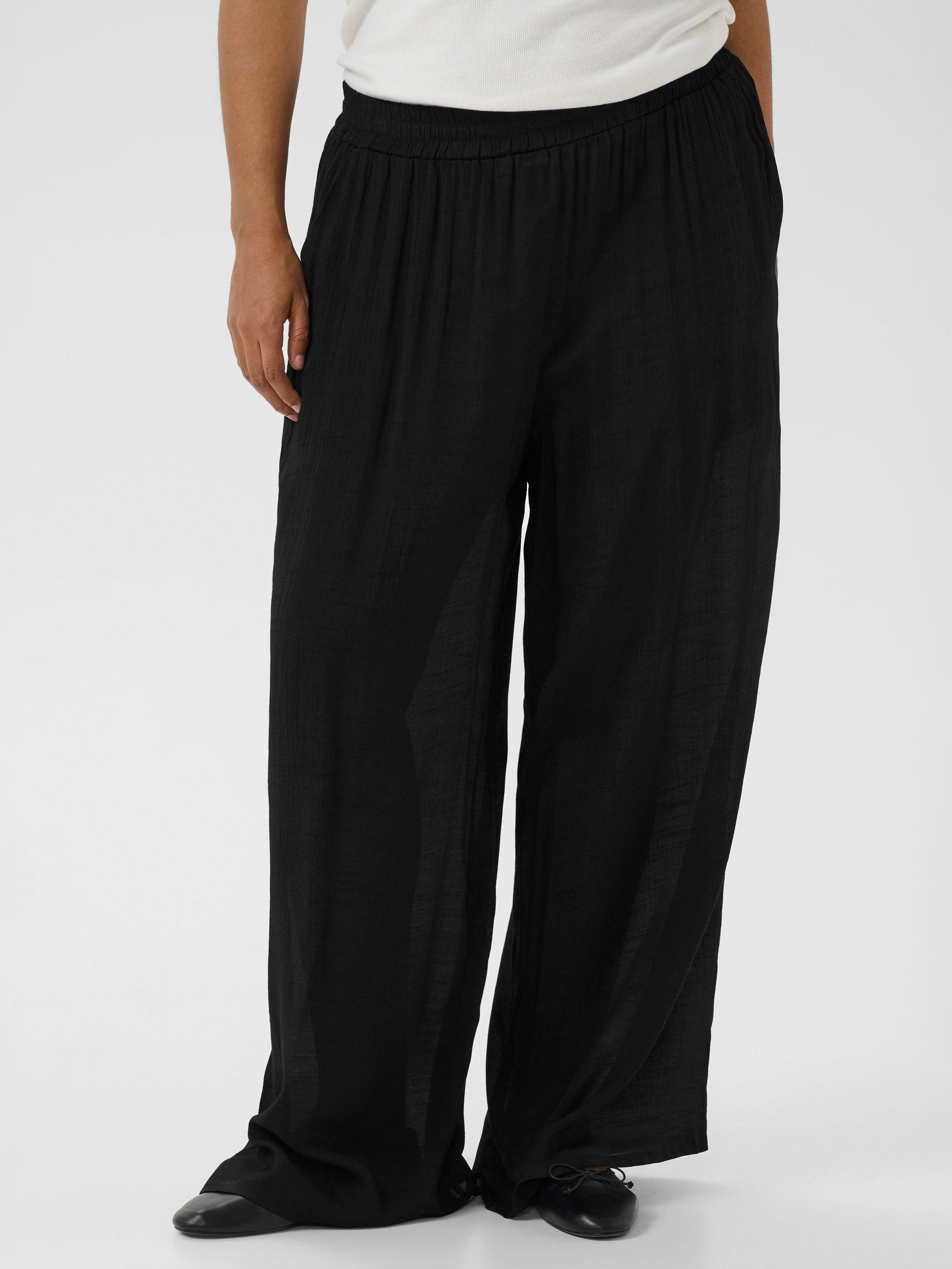 Product image 1 of 6, which shows KAFFE Curve Alia Wide Leg Trousers, Black Deep, 18