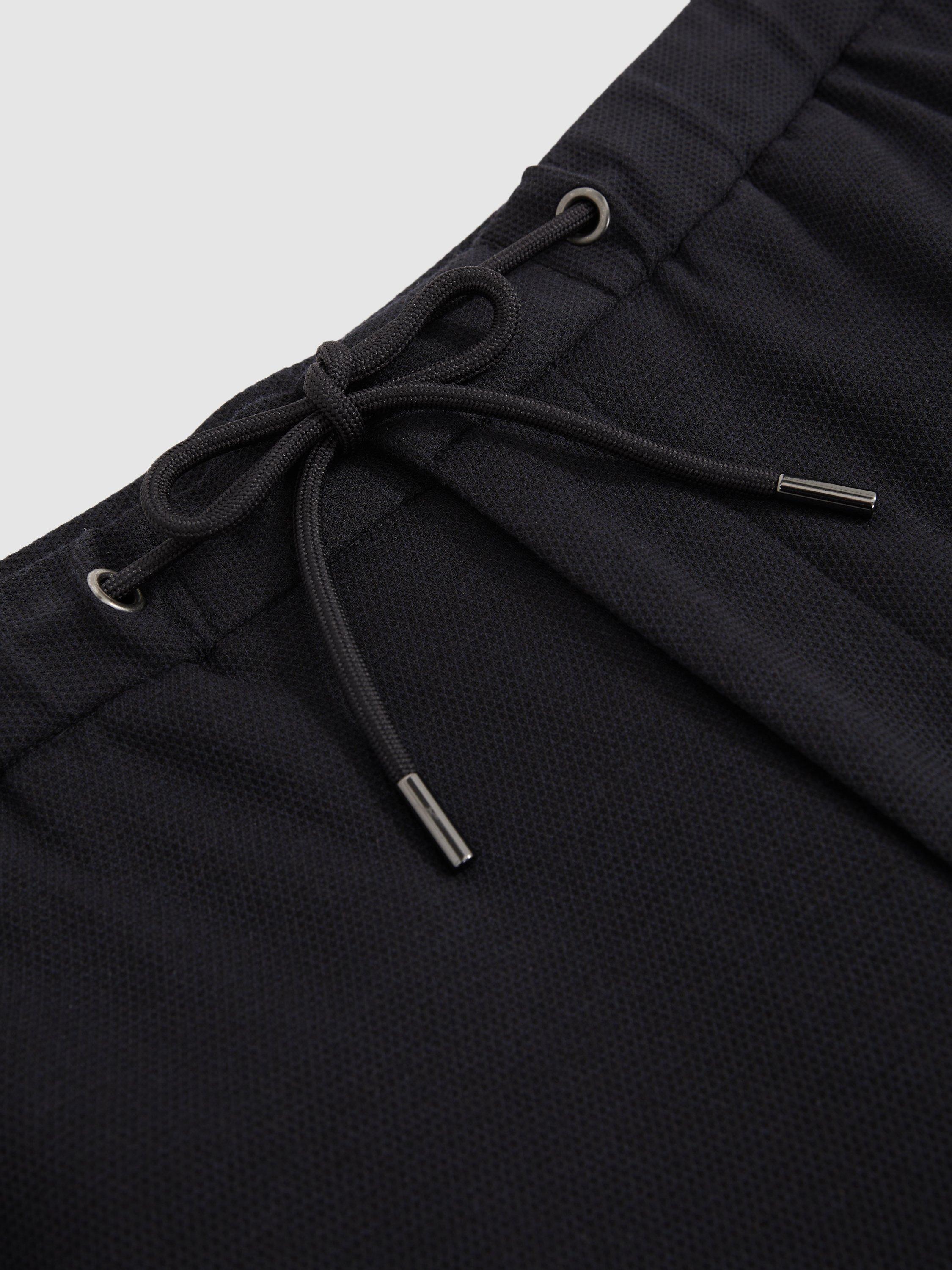Product image 2 of 5, which shows Reiss Gerrard Slim Fit Jersey Drawstring Suit Trousers, Navy, 28R