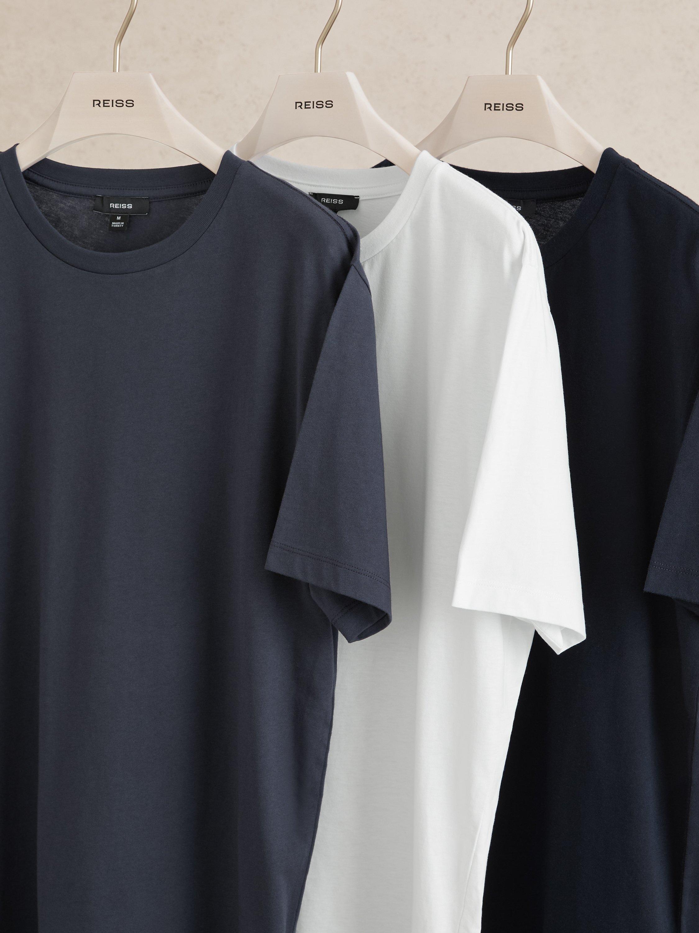 Product image 3 of 5, which shows Reiss Bless Cotton Regular Fit Short Sleeve T-Shirt, Pack of 3, White/Nvy/Airfrc Bl, XS