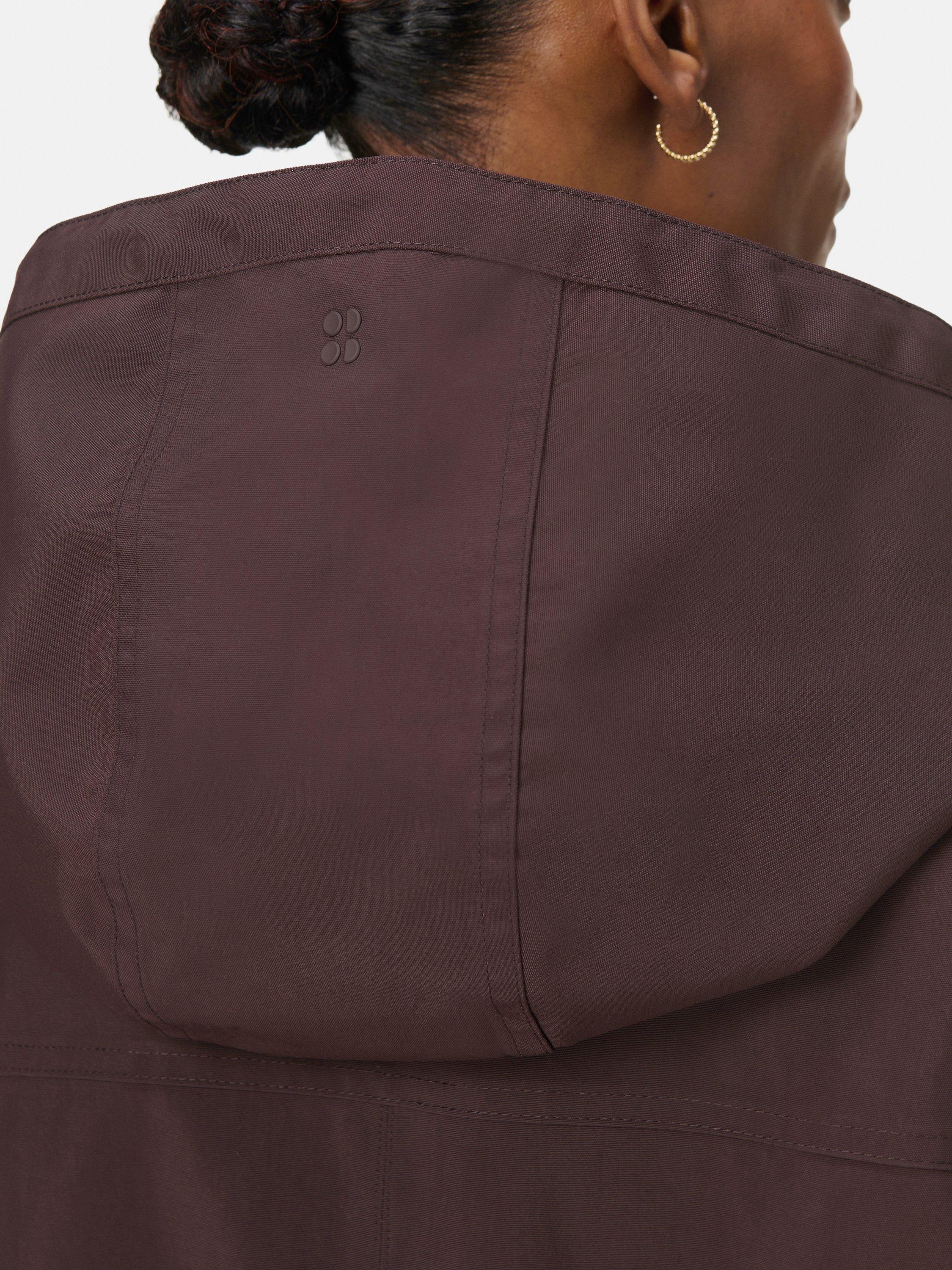 Product image 6 of 10, which shows Sweaty Betty Stride Waterproof Parka, Sable Brown, S