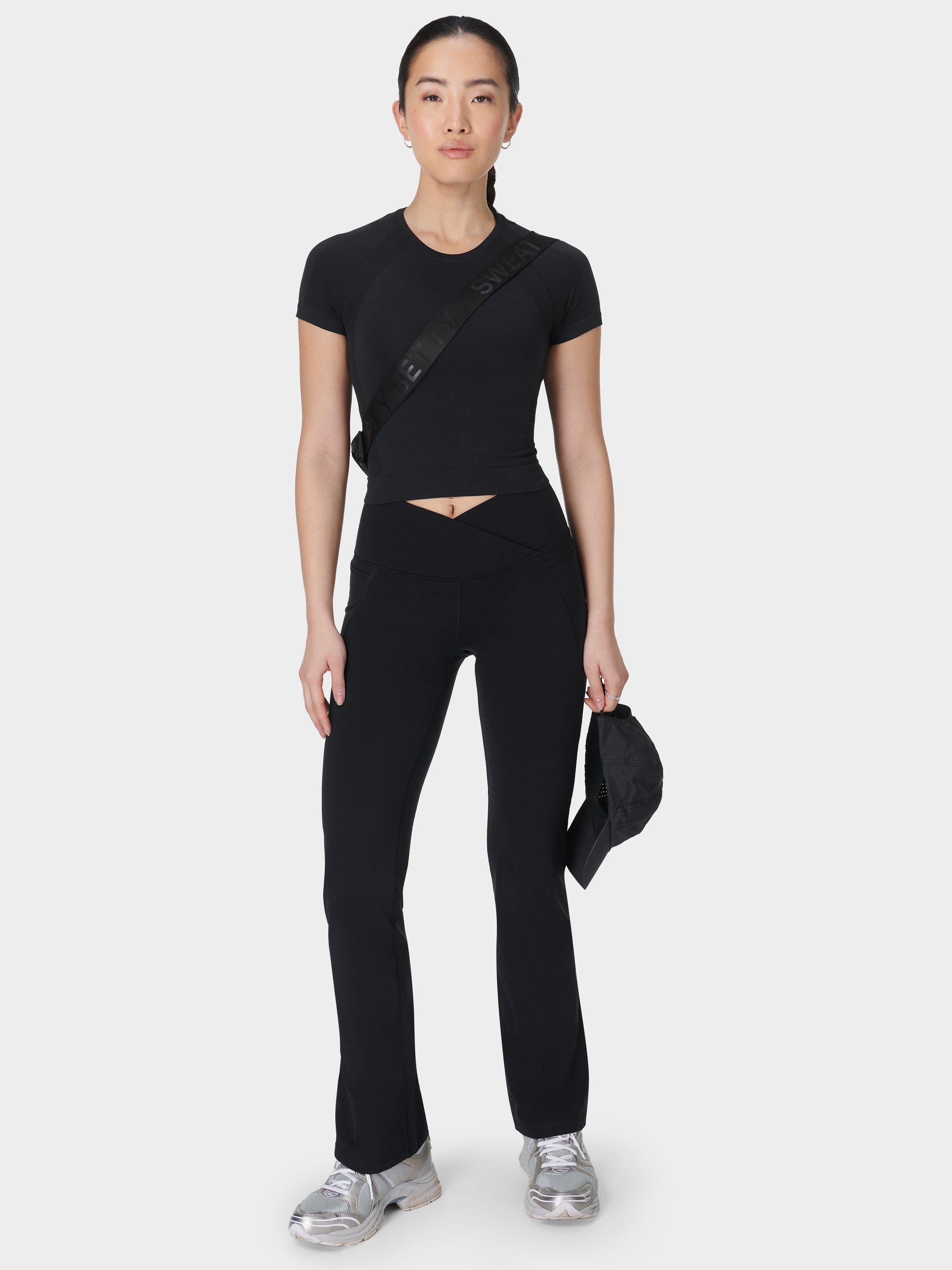Product image 6 of 11, which shows Sweaty Betty Power Wrap Waist Bootcut 32" Workout Trousers, Black, S