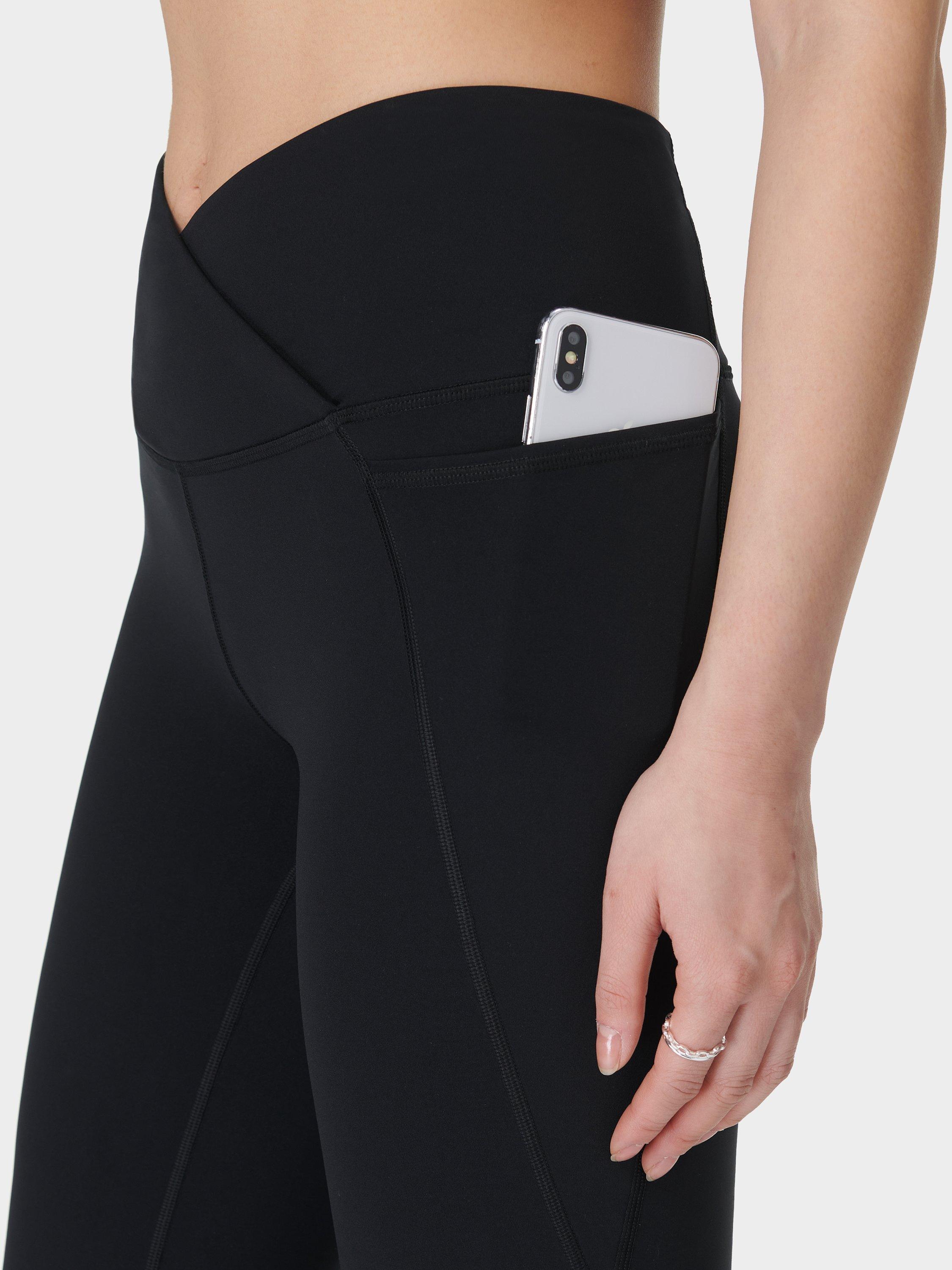 Product image 8 of 11, which shows Sweaty Betty Power Wrap Waist Bootcut 32" Workout Trousers, Black, S