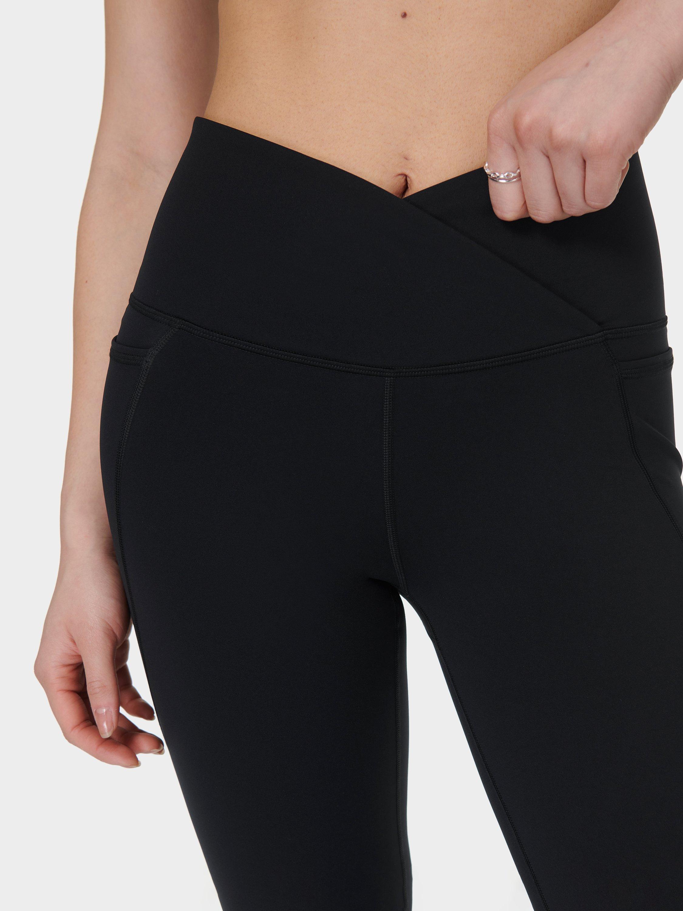 Product image 9 of 11, which shows Sweaty Betty Power Wrap Waist Bootcut 32" Workout Trousers, Black, S