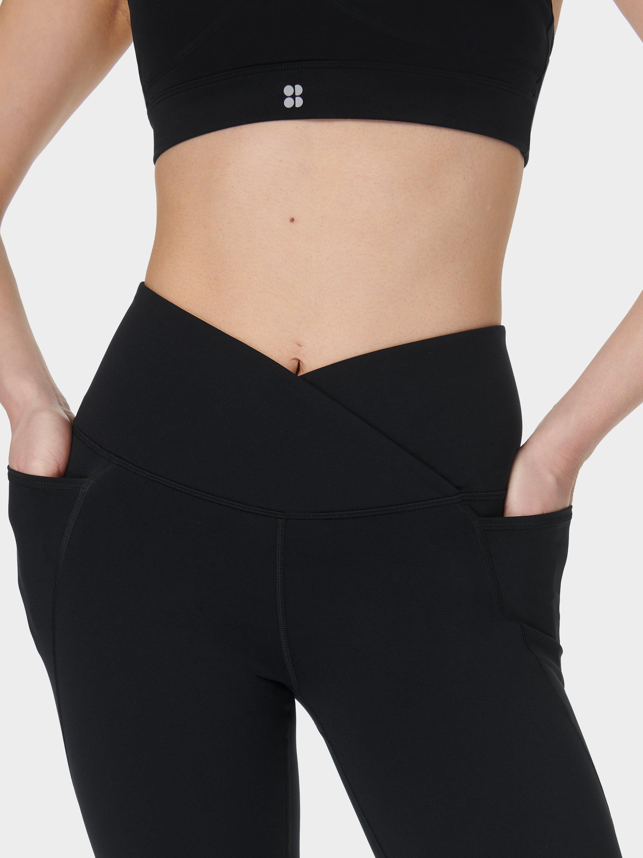 Product image 10 of 11, which shows Sweaty Betty Power Wrap Waist Bootcut 32" Workout Trousers, Black, S