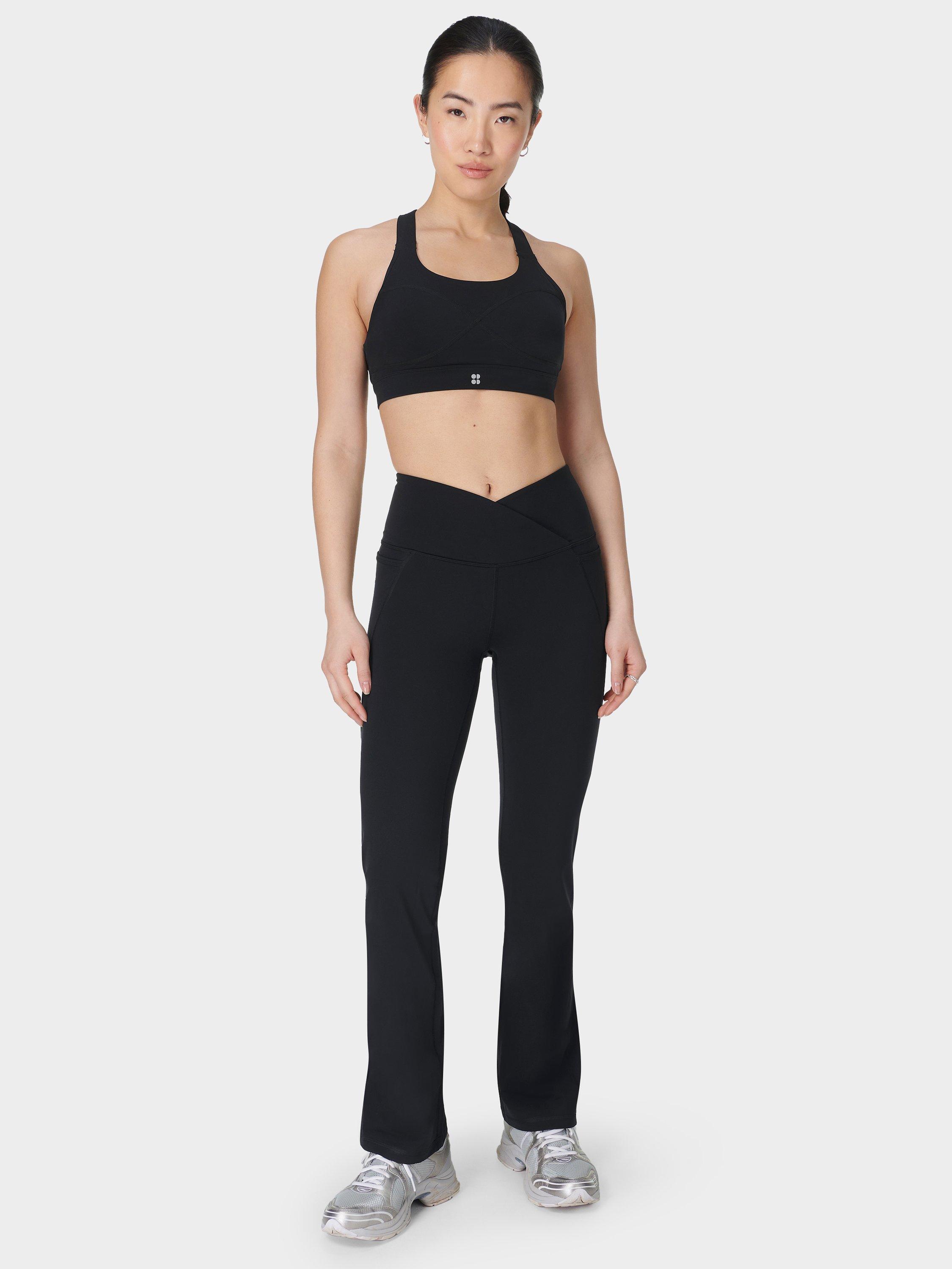 Product image 2 of 11, which shows Sweaty Betty Power 30" Wrap Waist Bootcut Workout Trousers, Black, XS