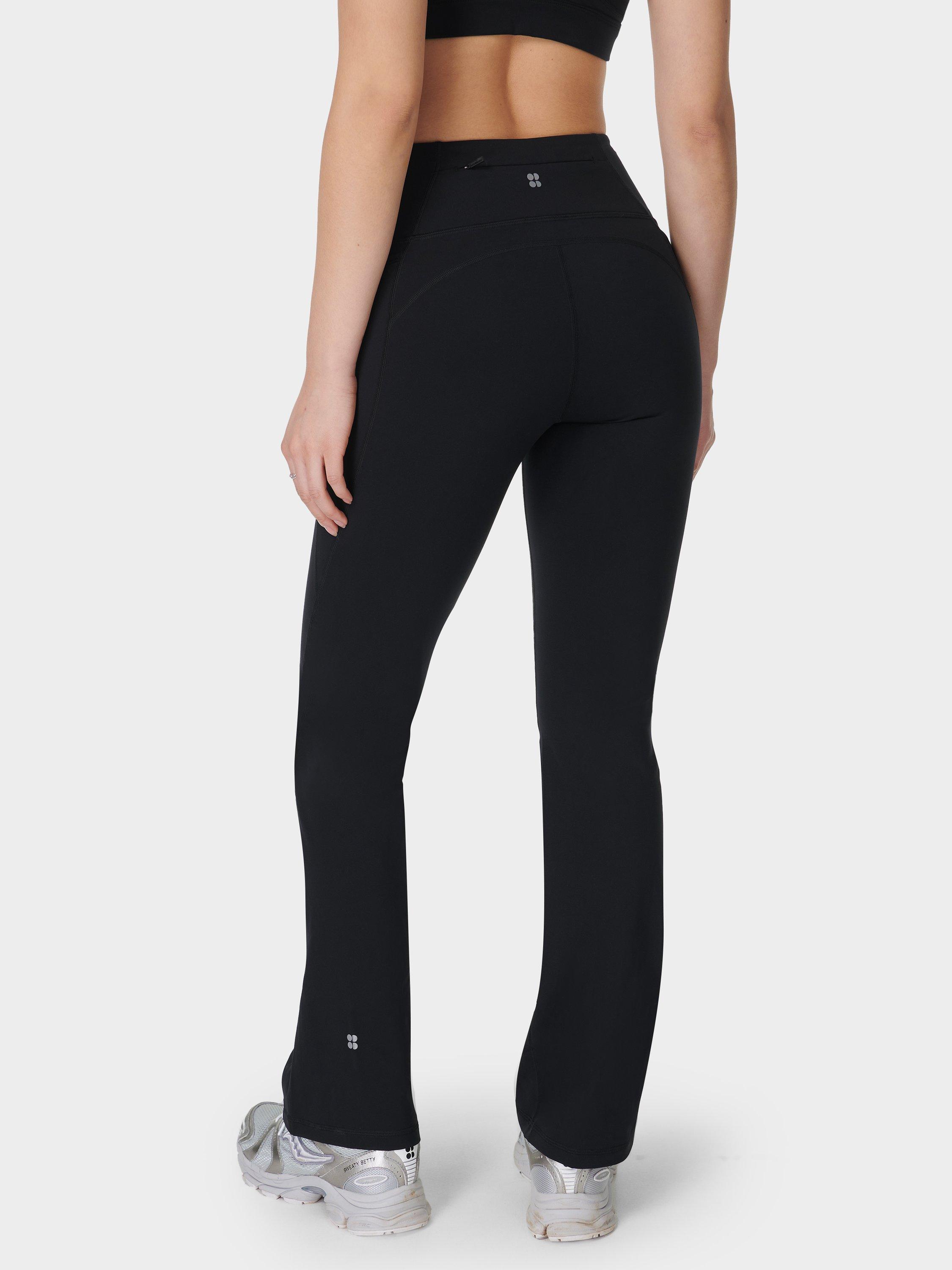 Product image 3 of 11, which shows Sweaty Betty Power 30" Wrap Waist Bootcut Workout Trousers, Black, XS