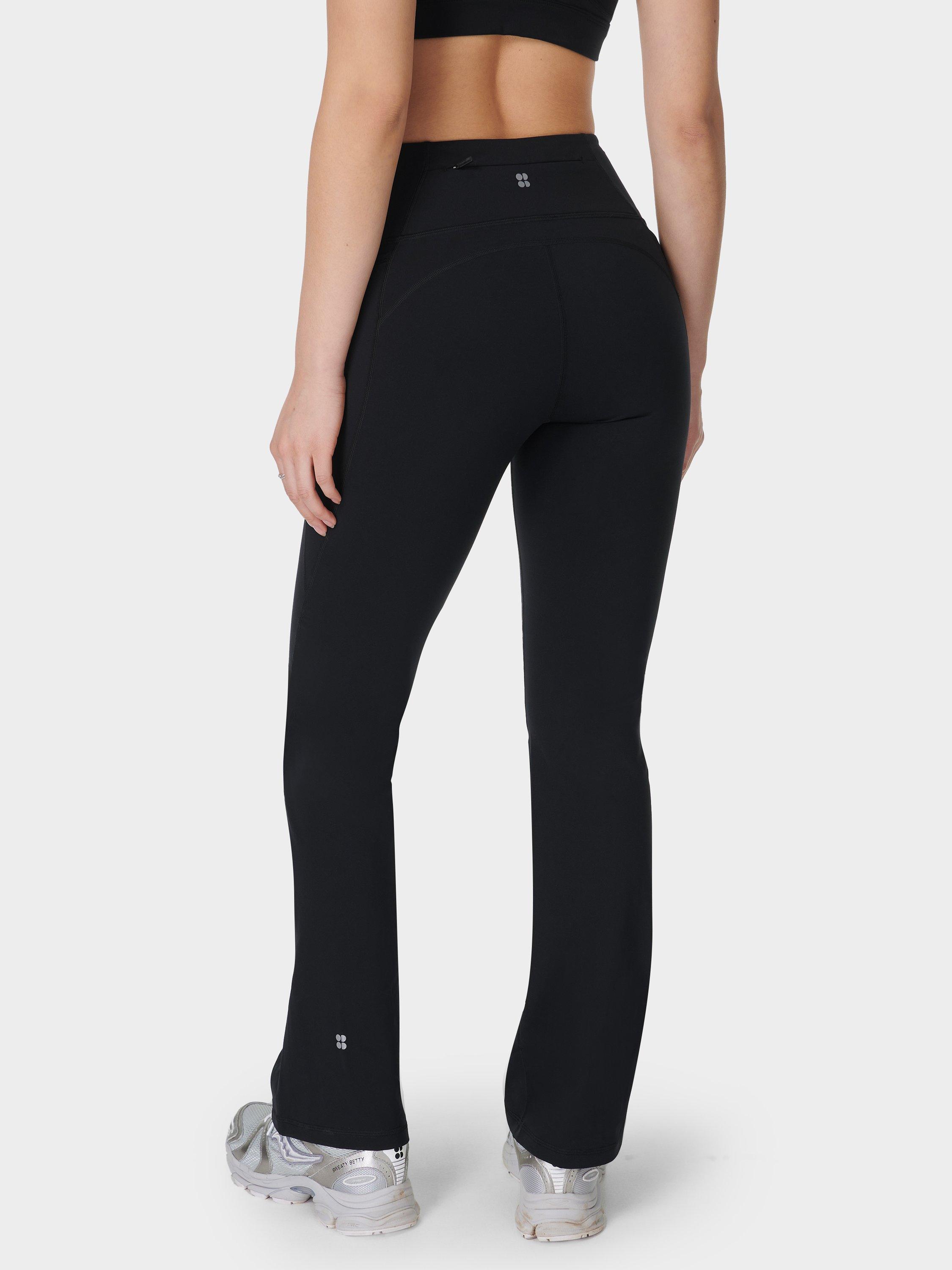 Product image 4 of 11, which shows Sweaty Betty Power 30" Wrap Waist Bootcut Workout Trousers, Black, XS