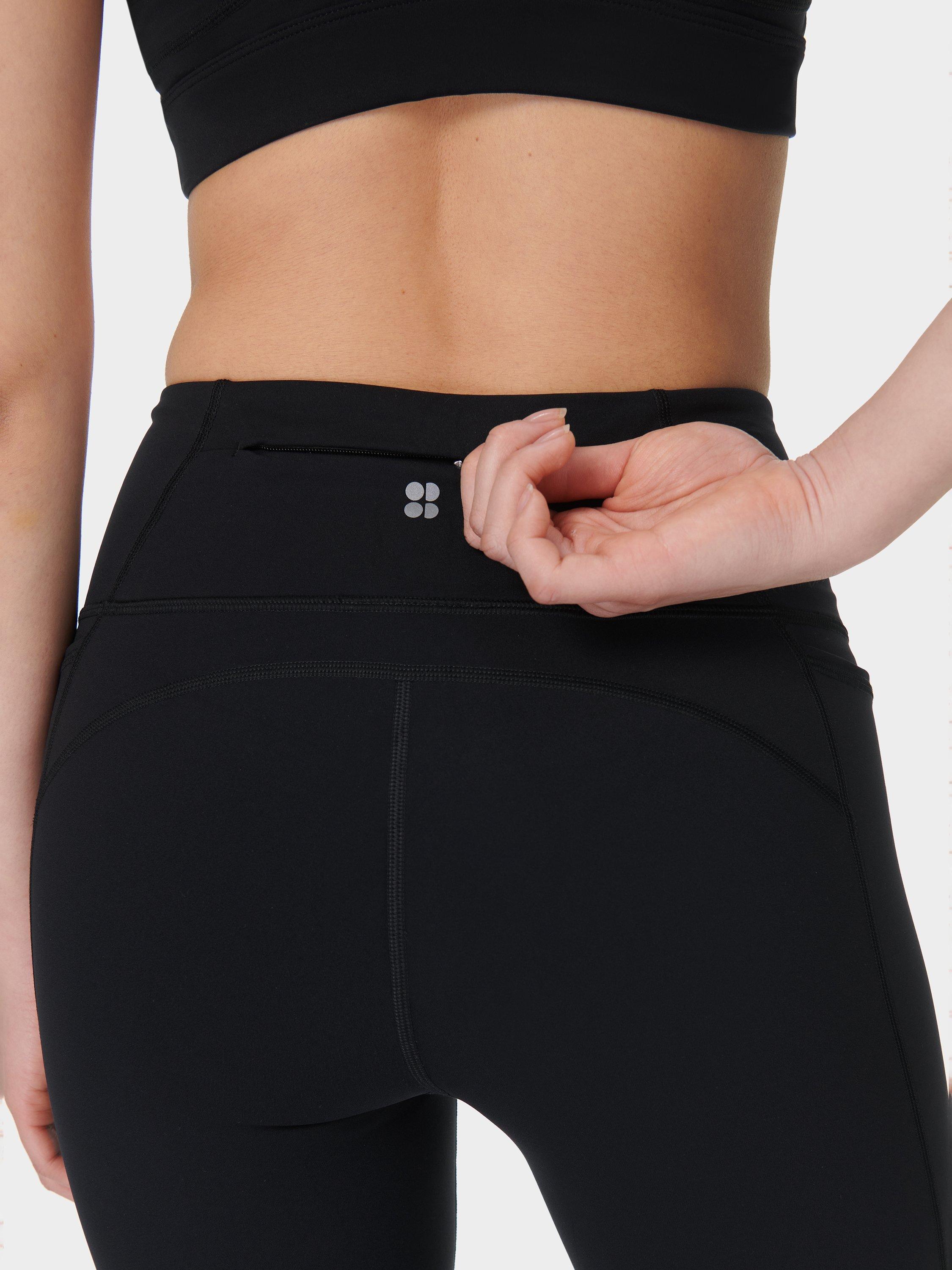 Product image 6 of 11, which shows Sweaty Betty Power 30" Wrap Waist Bootcut Workout Trousers, Black, XS