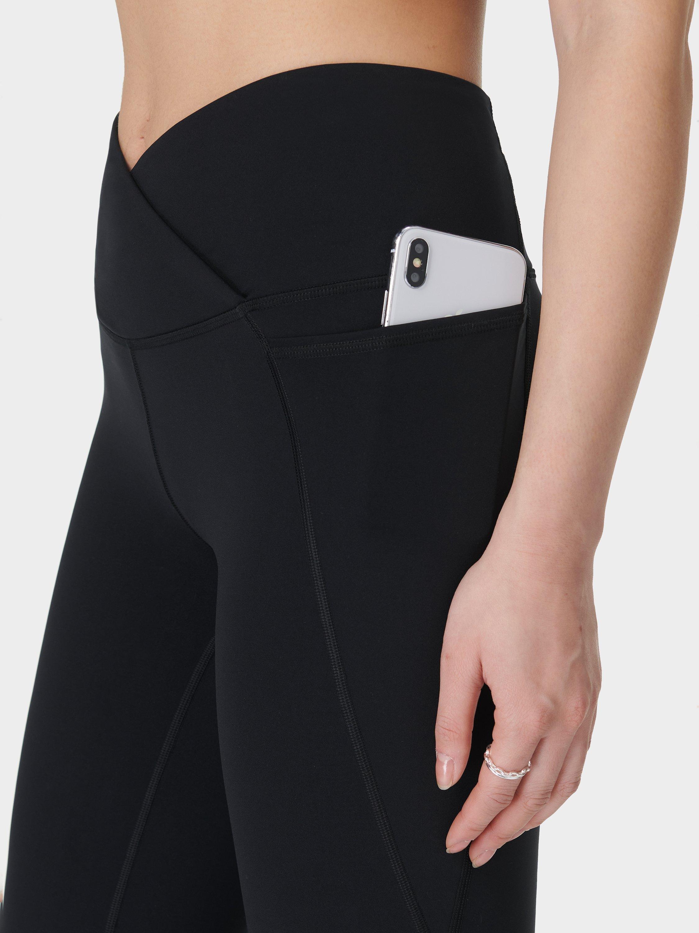 Product image 7 of 11, which shows Sweaty Betty Power 30" Wrap Waist Bootcut Workout Trousers, Black, XS