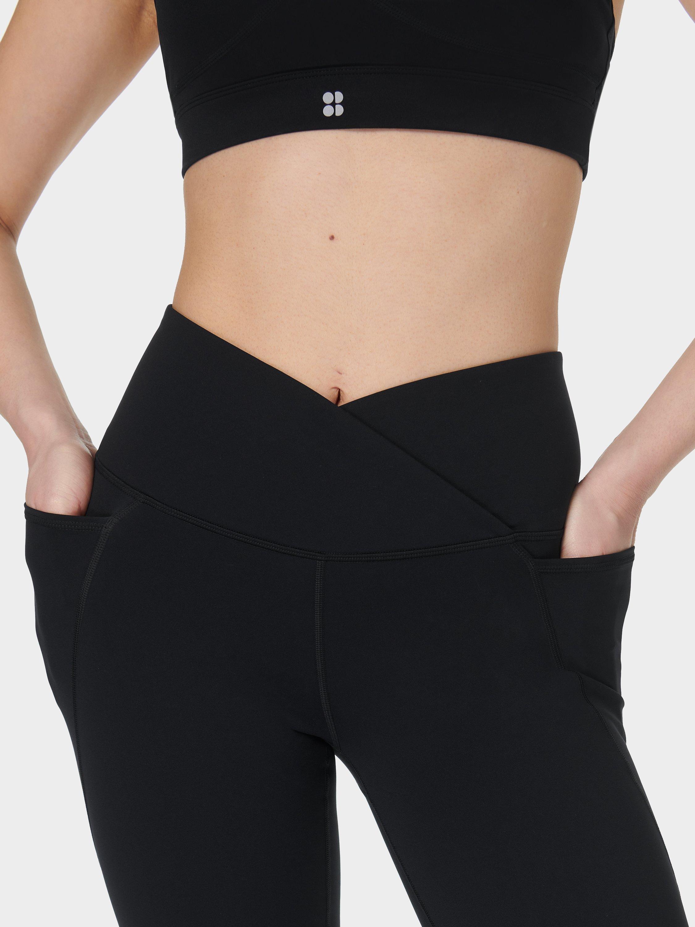 Product image 9 of 11, which shows Sweaty Betty Power 30" Wrap Waist Bootcut Workout Trousers, Black, XS