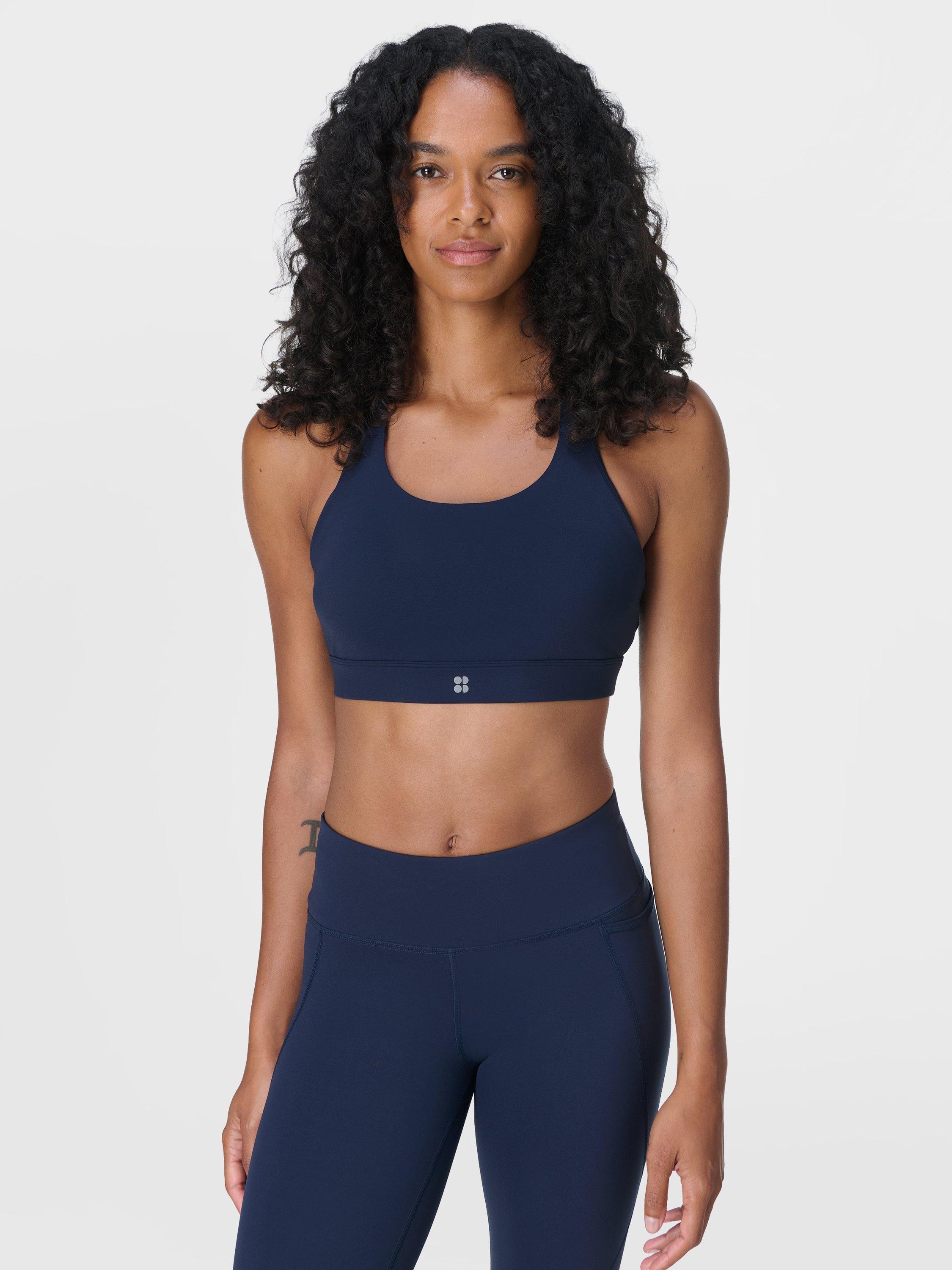 Product image 1 of 7, which shows Sweaty Betty Power Medium Support Seam-Free Bra, Navy Blue, XXS