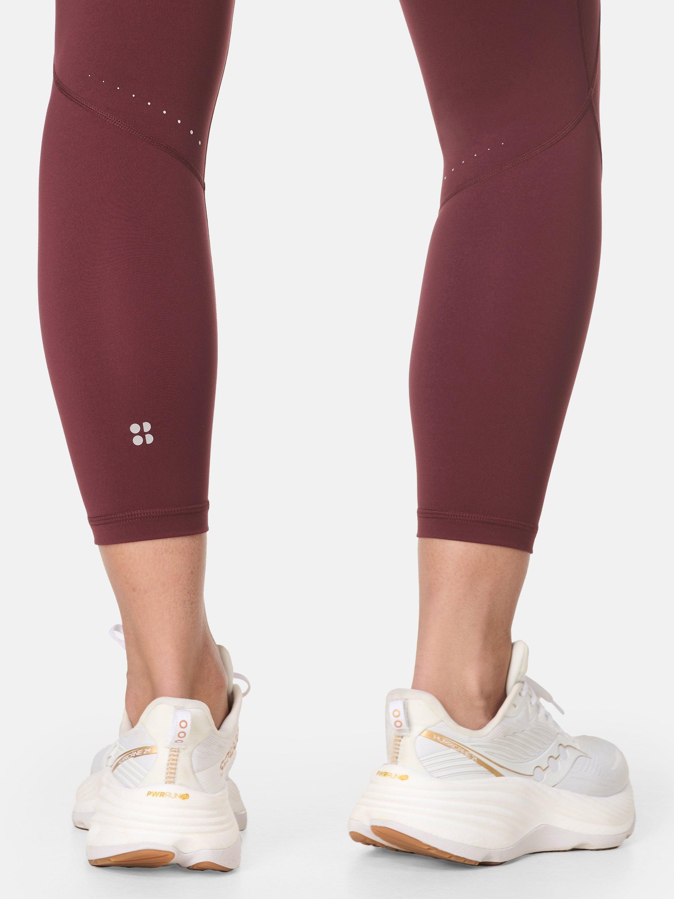 Product image 7 of 10, which shows Sweaty Betty Compressive Running Leggings, Garnet Red, XXS