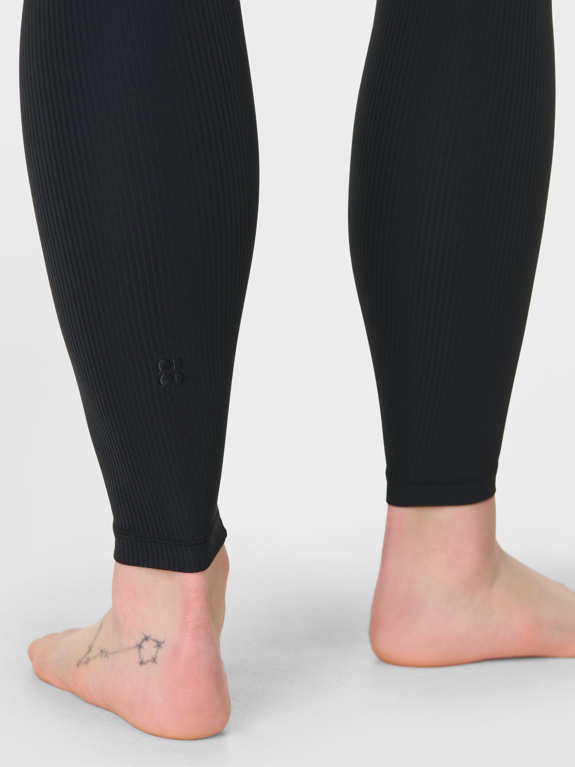Product image 7 of 8, which shows Sweaty Betty Glow Flex Rib Leggings, Black, XXS