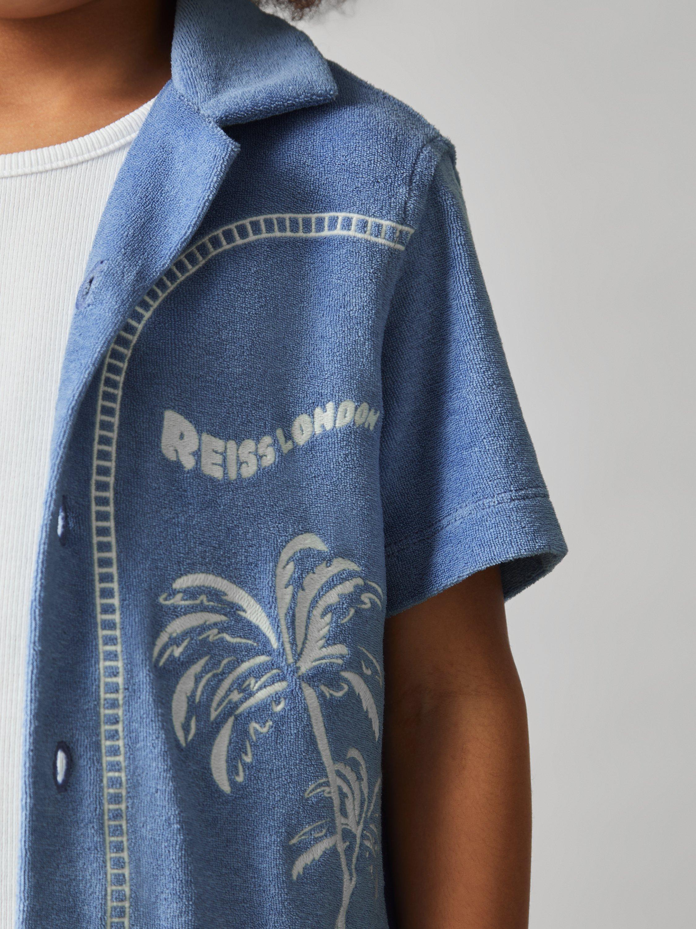 Product image 5 of 5, which shows Reiss Kids' Barnes Towelling Short Sleeve Shirt, Airforce Blue, 3-4 years