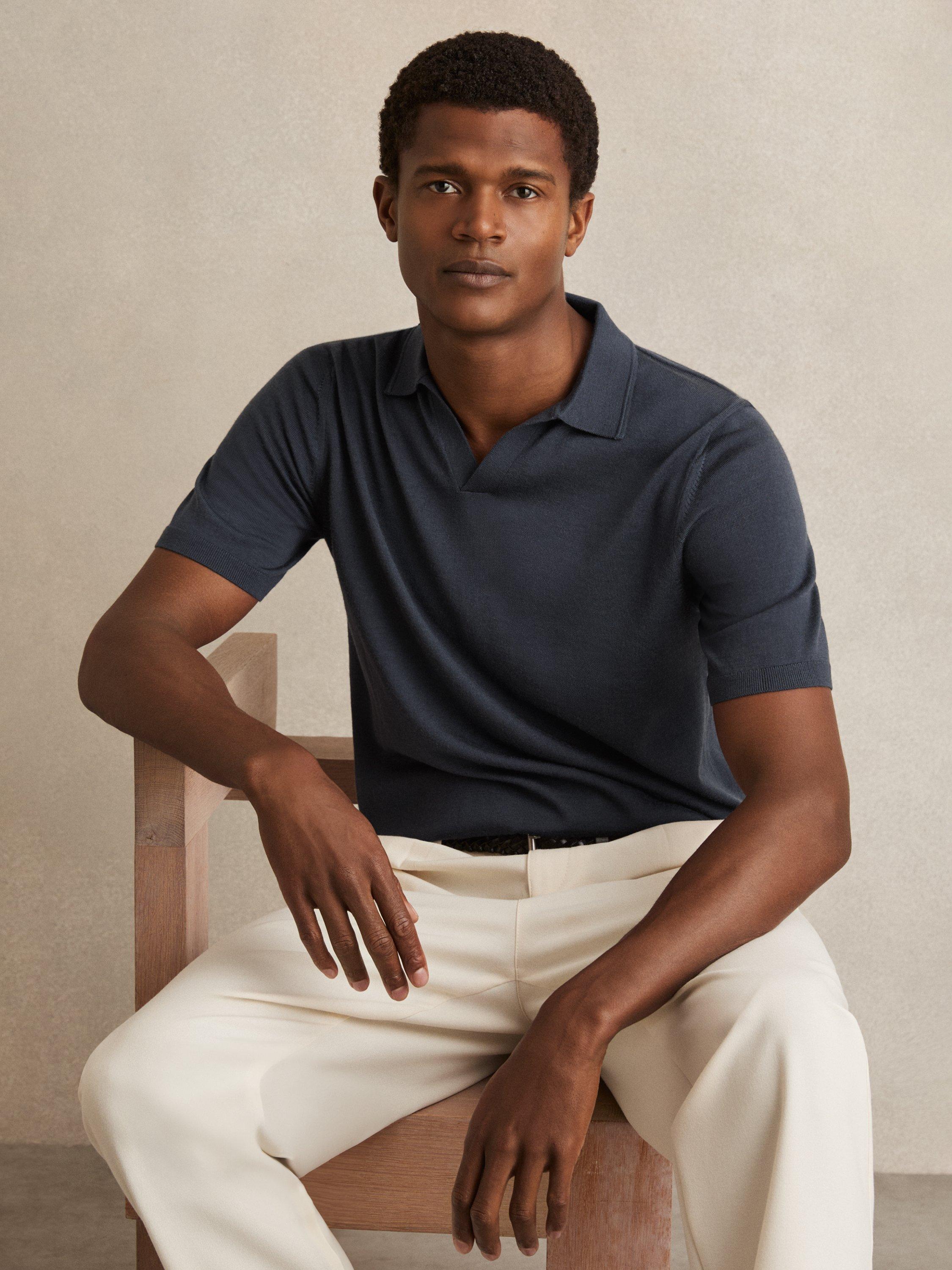 Product image 1 of 5, which shows Reiss Duchie Short Sleeve Open Collar Merino Wool Polo Shirt, Navy, XS