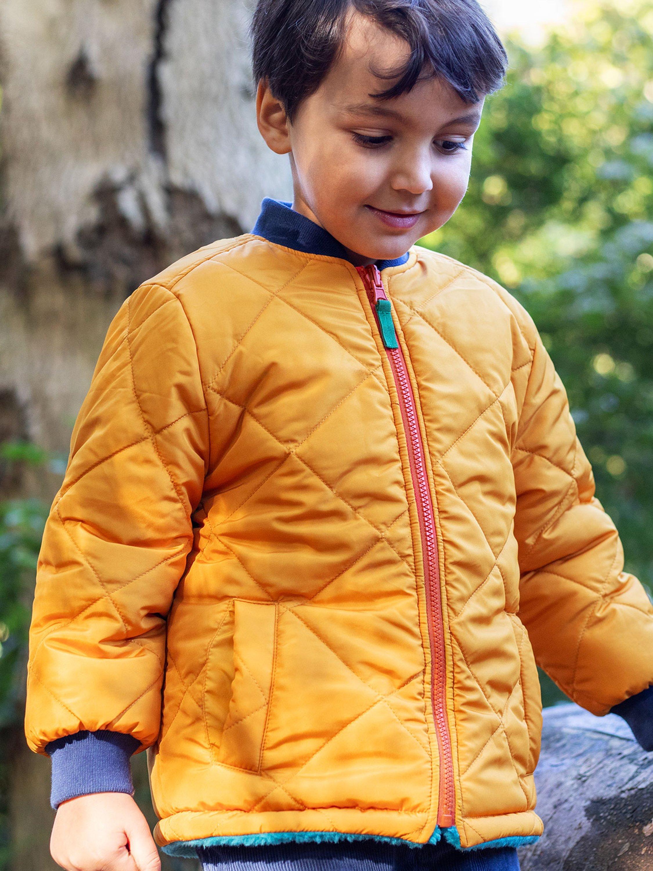 Product image 2 of 8, which shows Frugi Kids' Robin Quilted Reversible Jacket, Gold/Boat Blue, 2-3 years