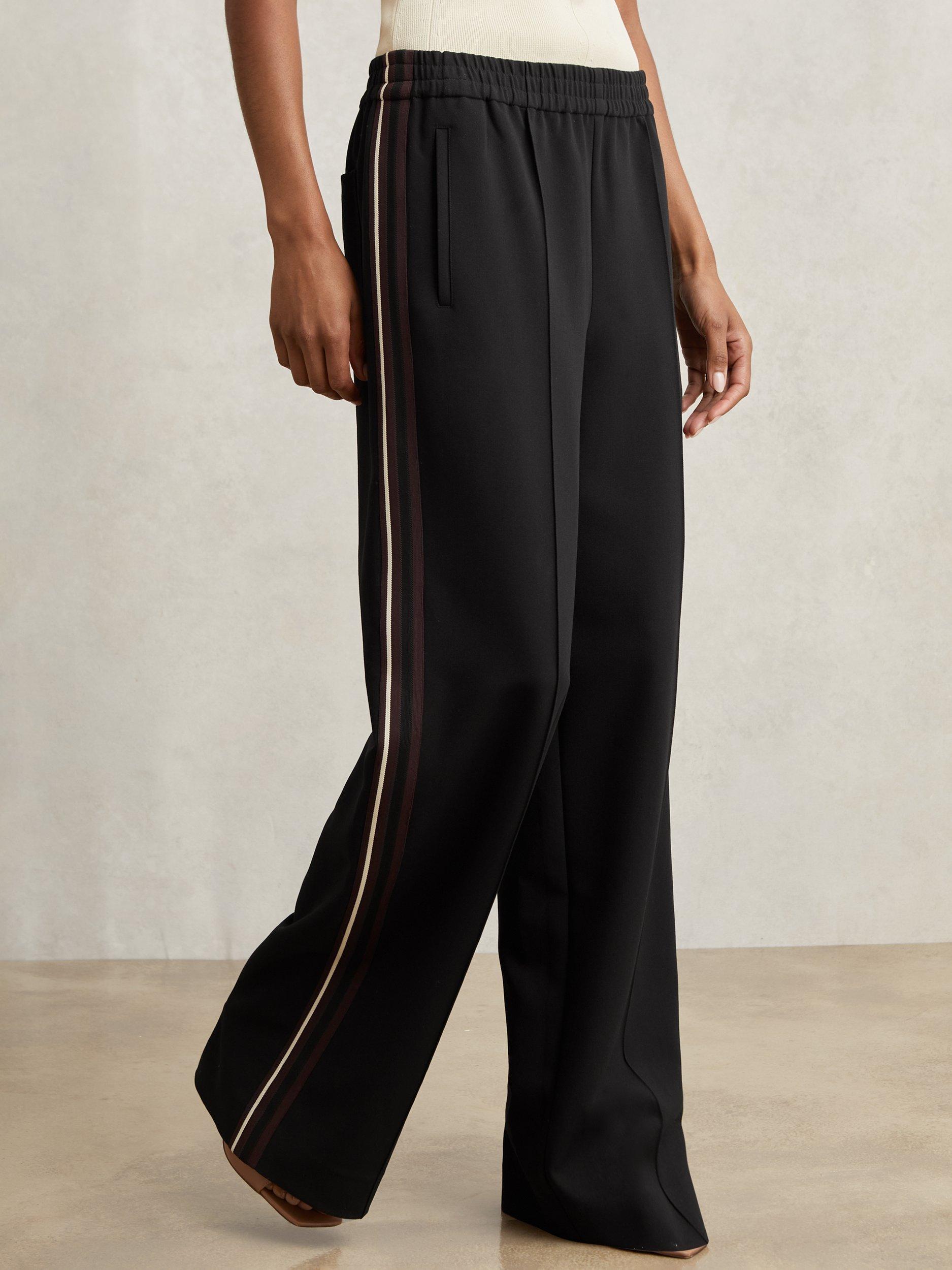 Product image 4 of 5, which shows Reiss Petite Robyn Side Stripe Trousers, Black, 6Pt