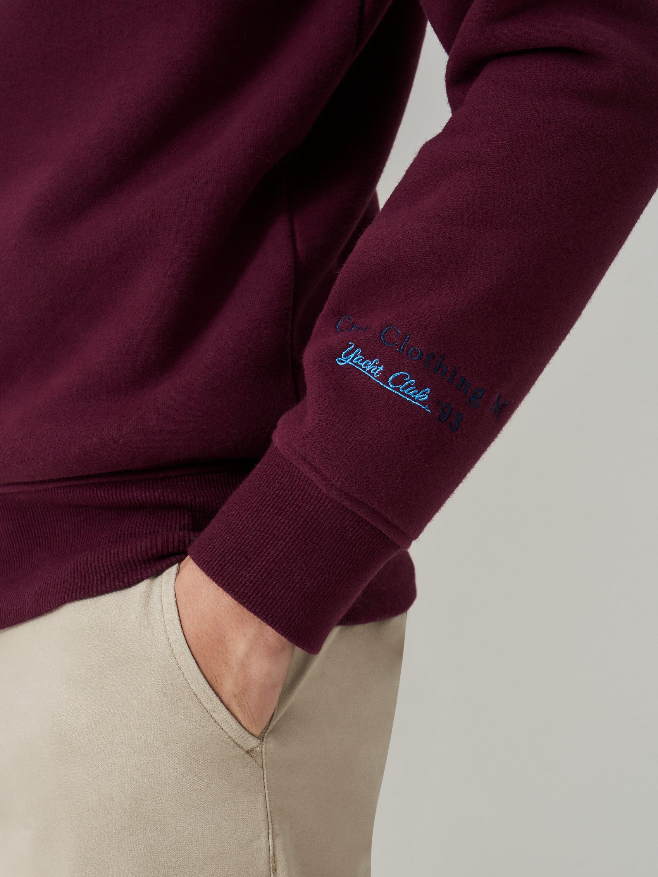Product image 4 of 5, which shows Crew Clothing Embroidered Flag Sweatshirt, Burgundy Red, L