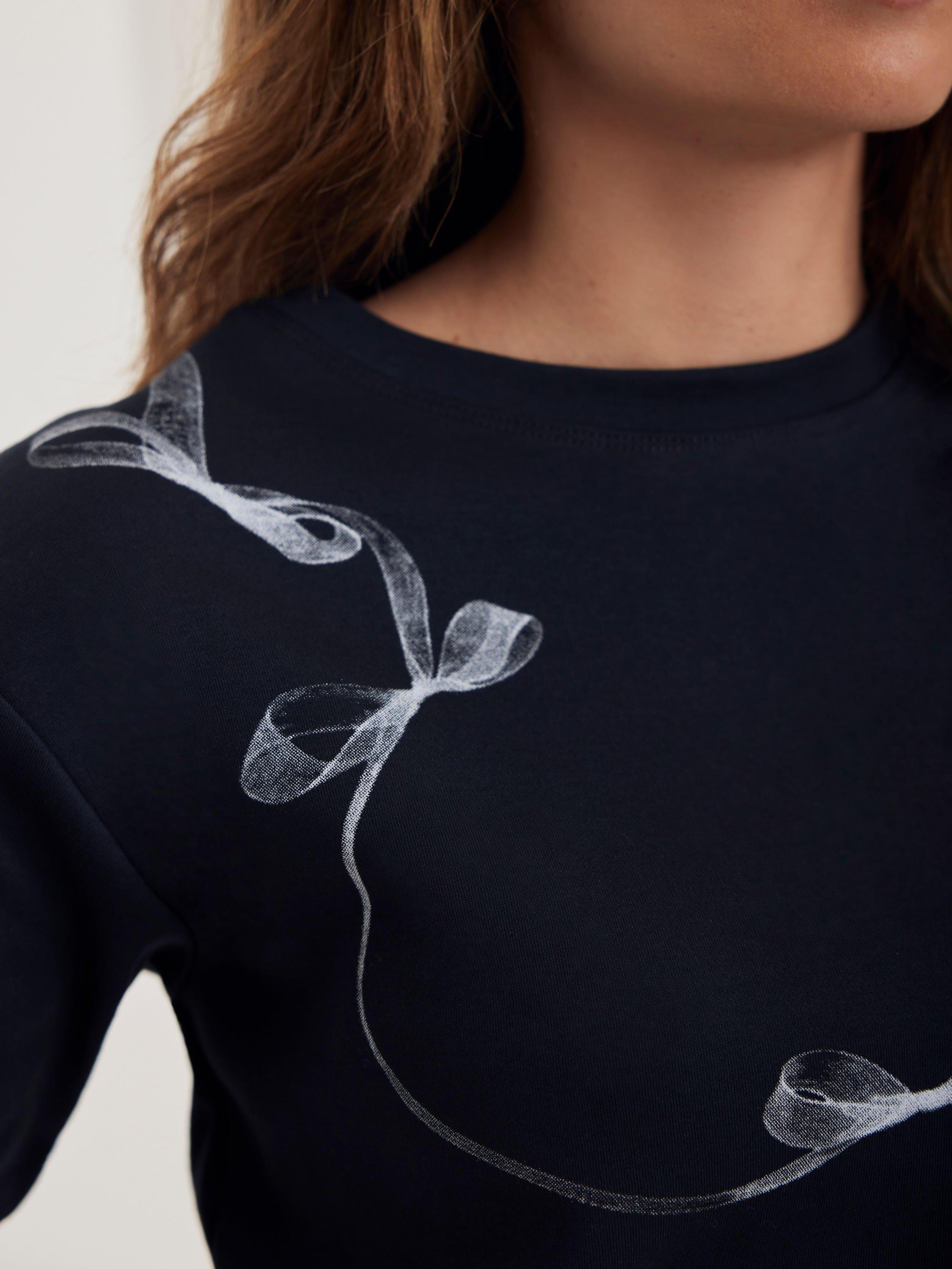 Product image 4 of 7, which shows Mint Velvet Graphic Ribbon Print Crew Neck Cotton T-Shirt, Navy, XS